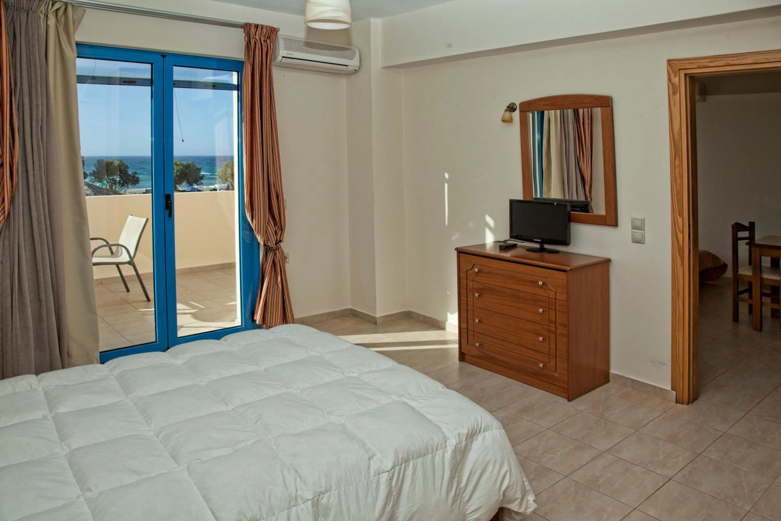Seating area, Bed in Gold Apartments