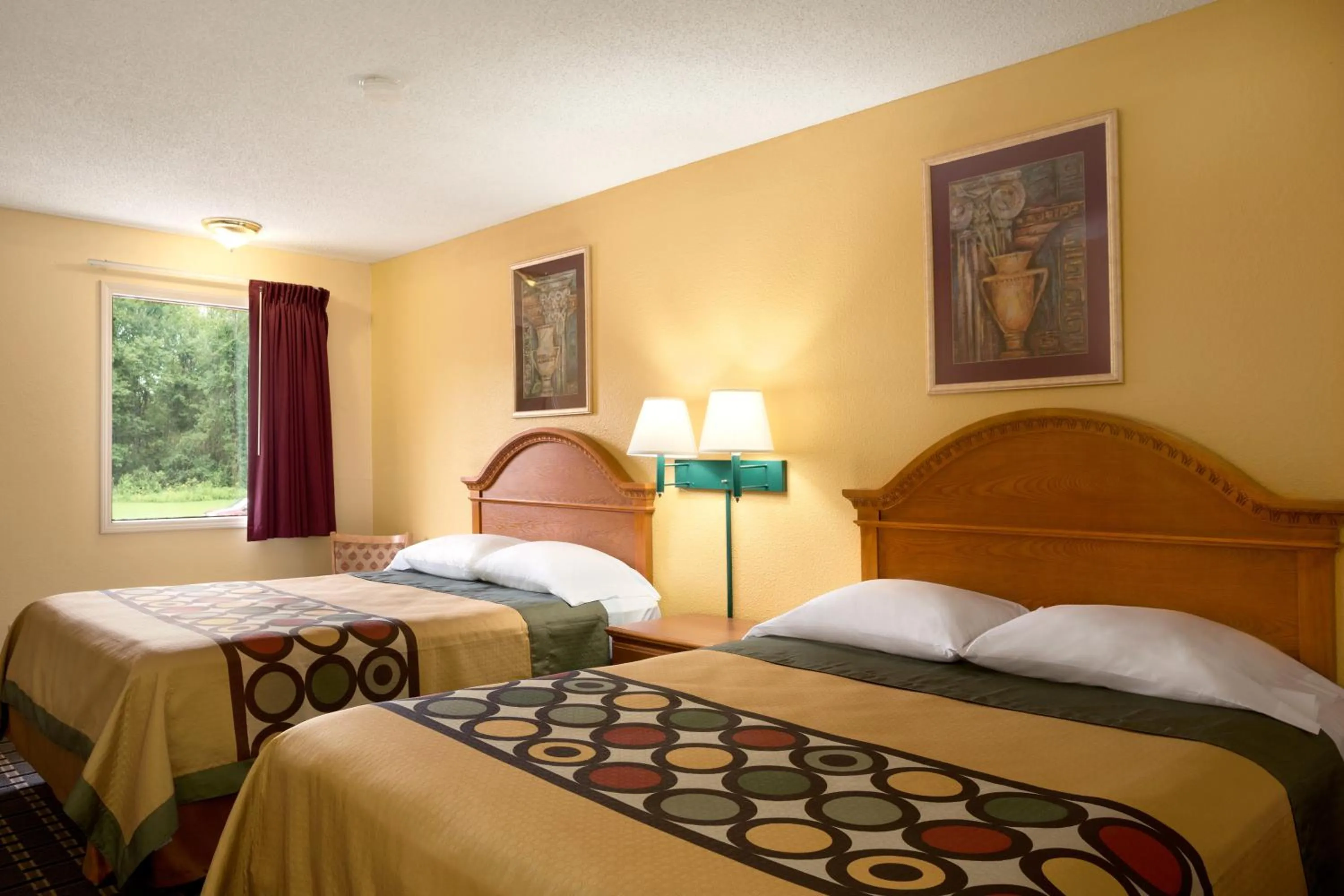 Bed in Super 8 by Wyndham Indianapolis-Southport Rd