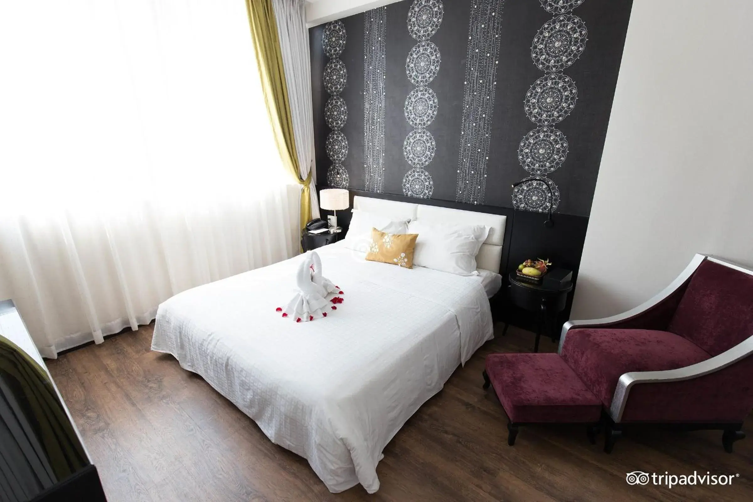 Seating area, Bed in Orchid Hotel Seating area, Bed in Orchid Hotel