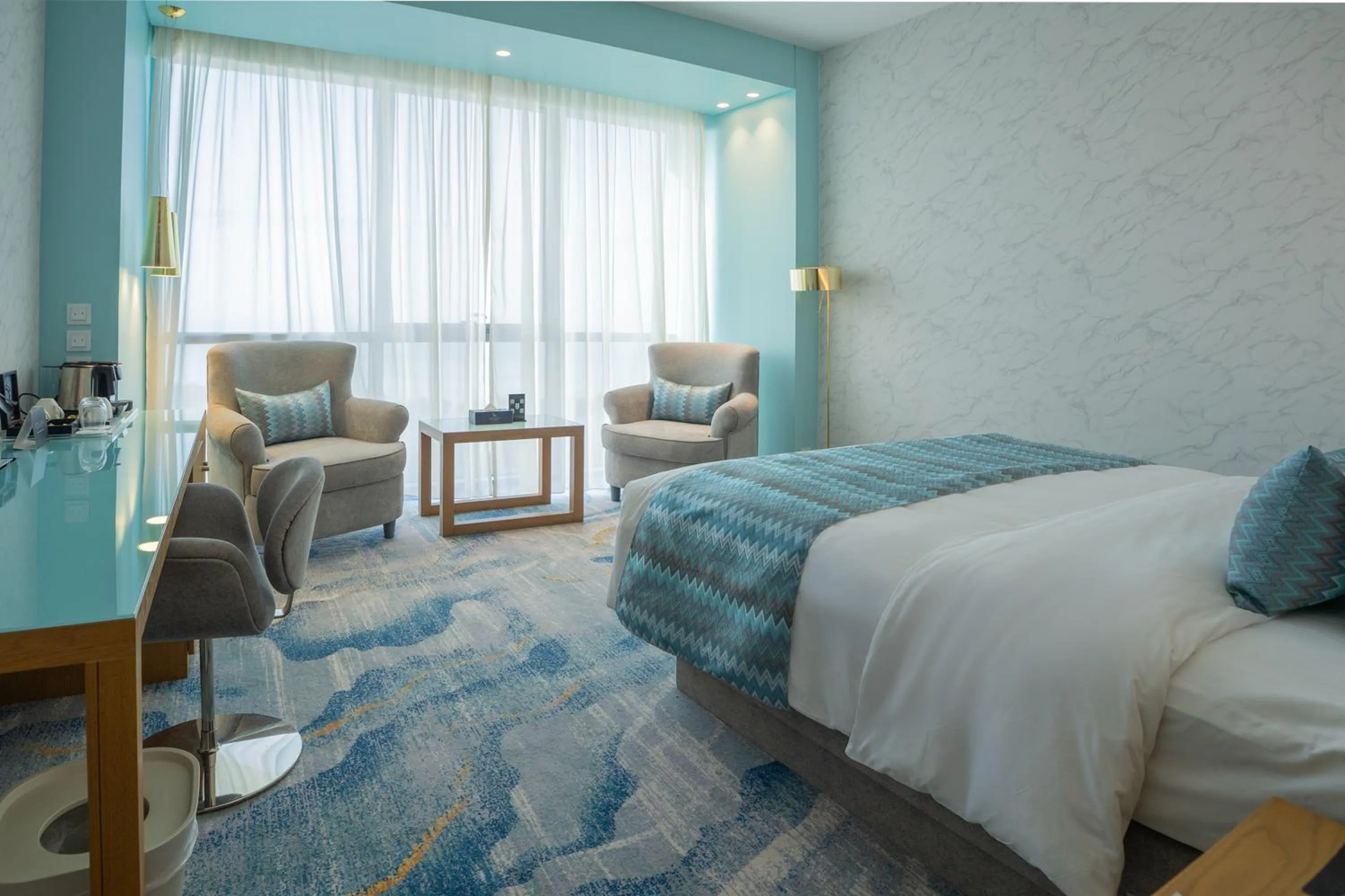 Seating area, Bed in Symphony Style Hotel Kuwait