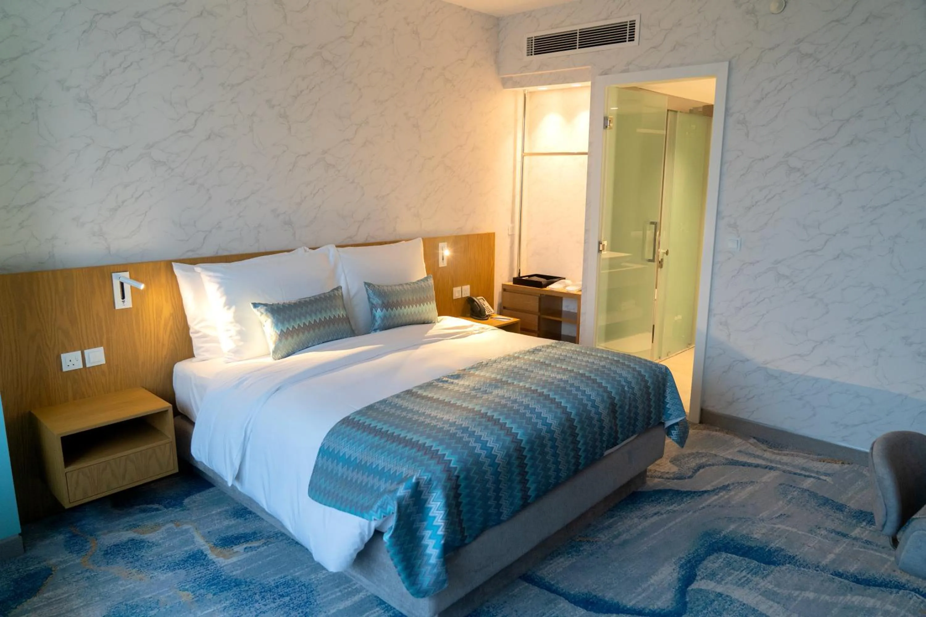 Bed in Symphony Style Hotel Kuwait