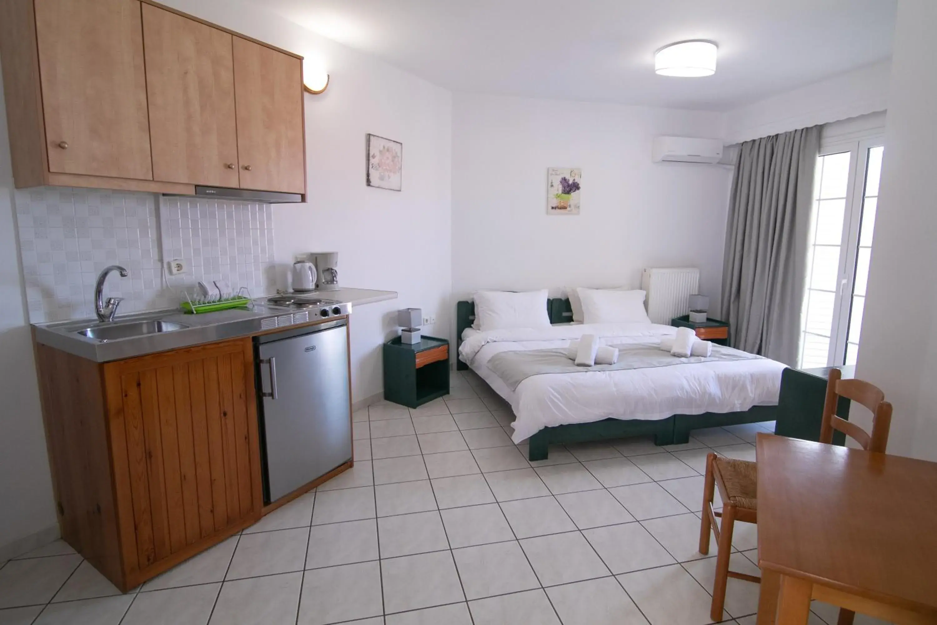 Bed in Malvasia Corner Studios - ex Romeo's House Bed in Malvasia Corner Studios - ex Romeo's House