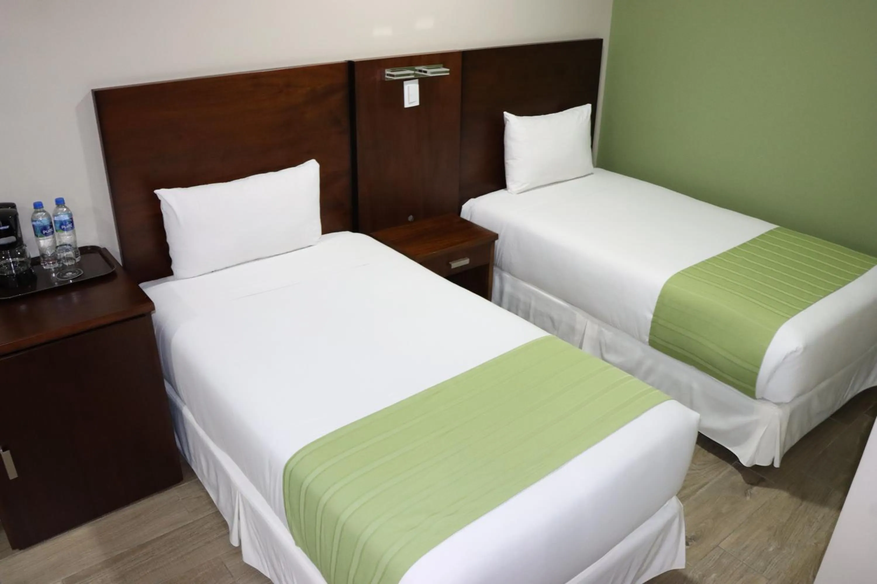 Bed in Hotel San Agustin Plaza