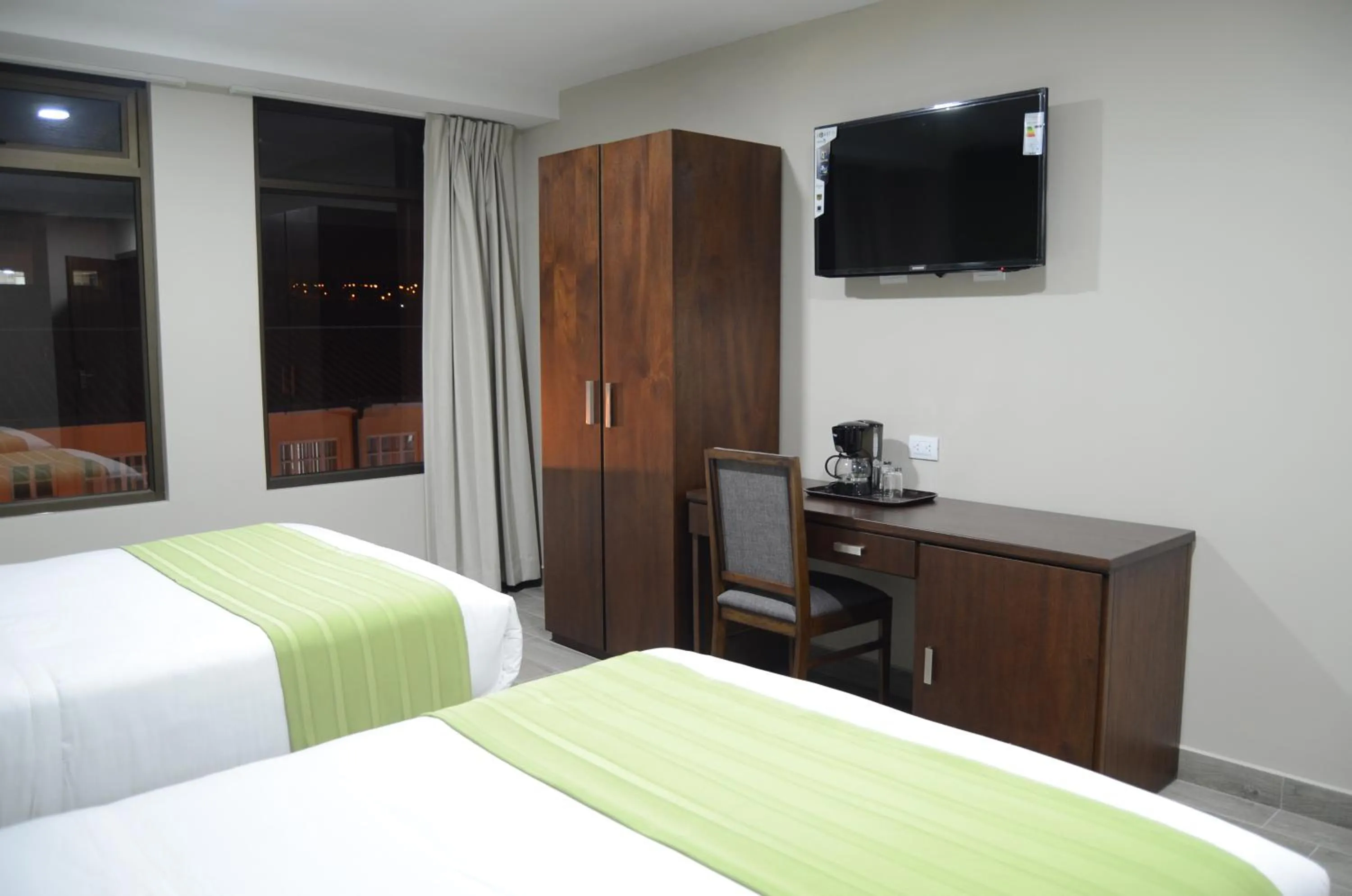 Bed in Hotel San Agustin Plaza