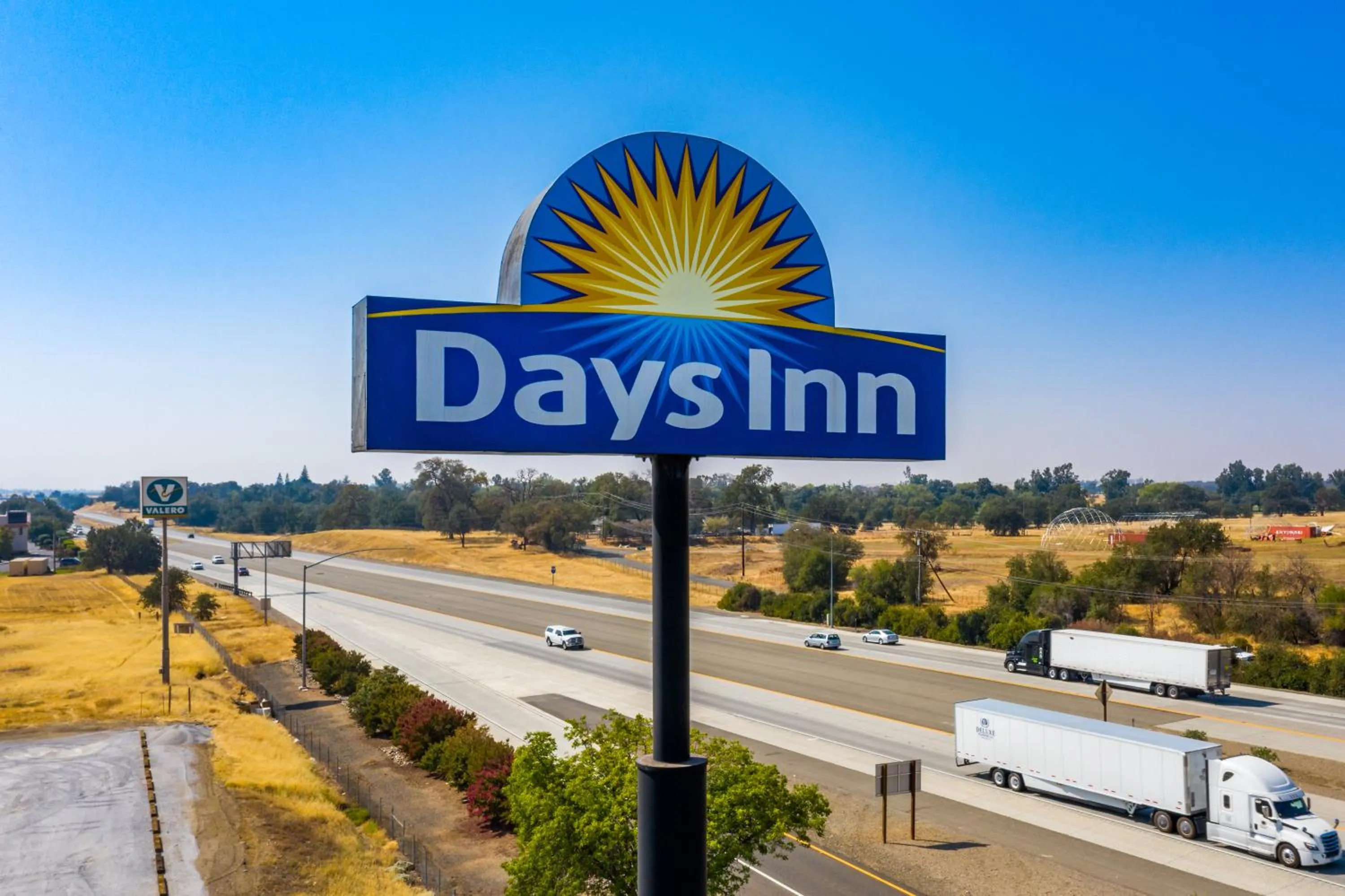Property logo or sign in Days Inn by Wyndham Red Bluff