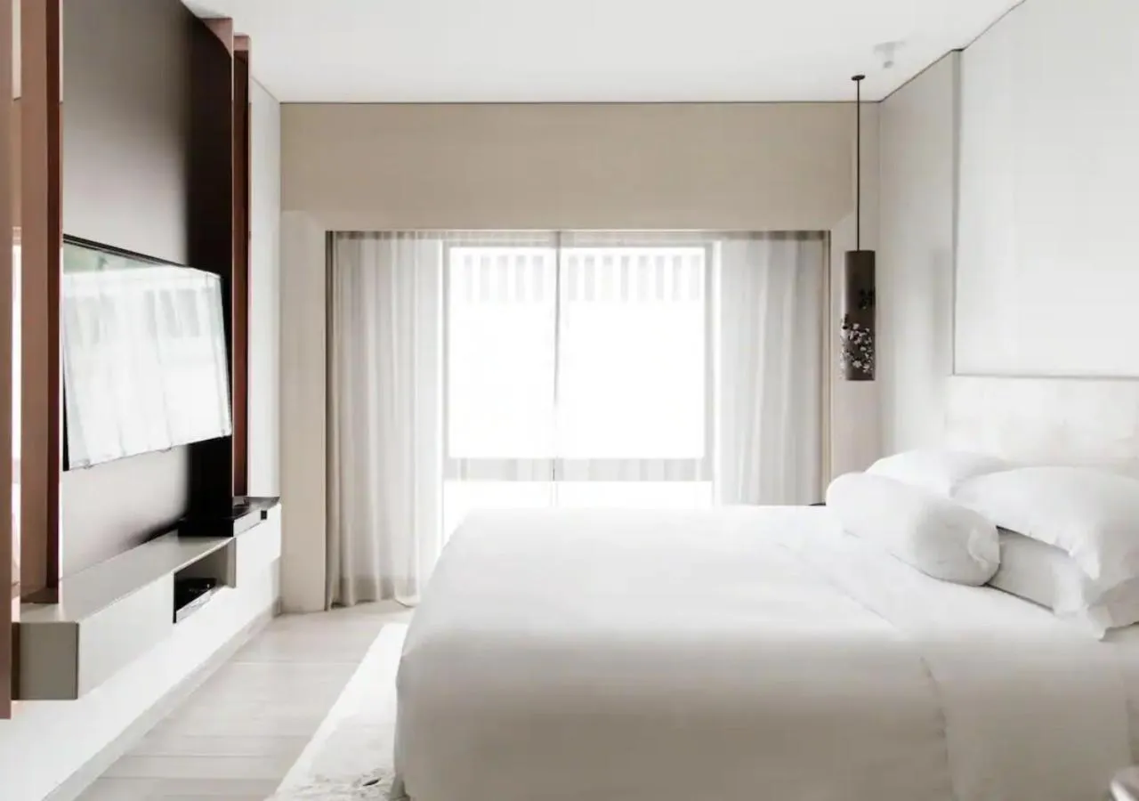 Bed in Naumi Hotel Singapore