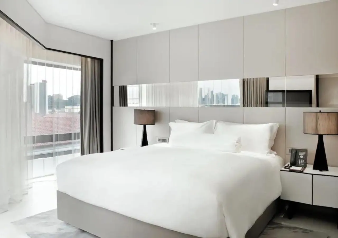 Bed in Naumi Hotel Singapore