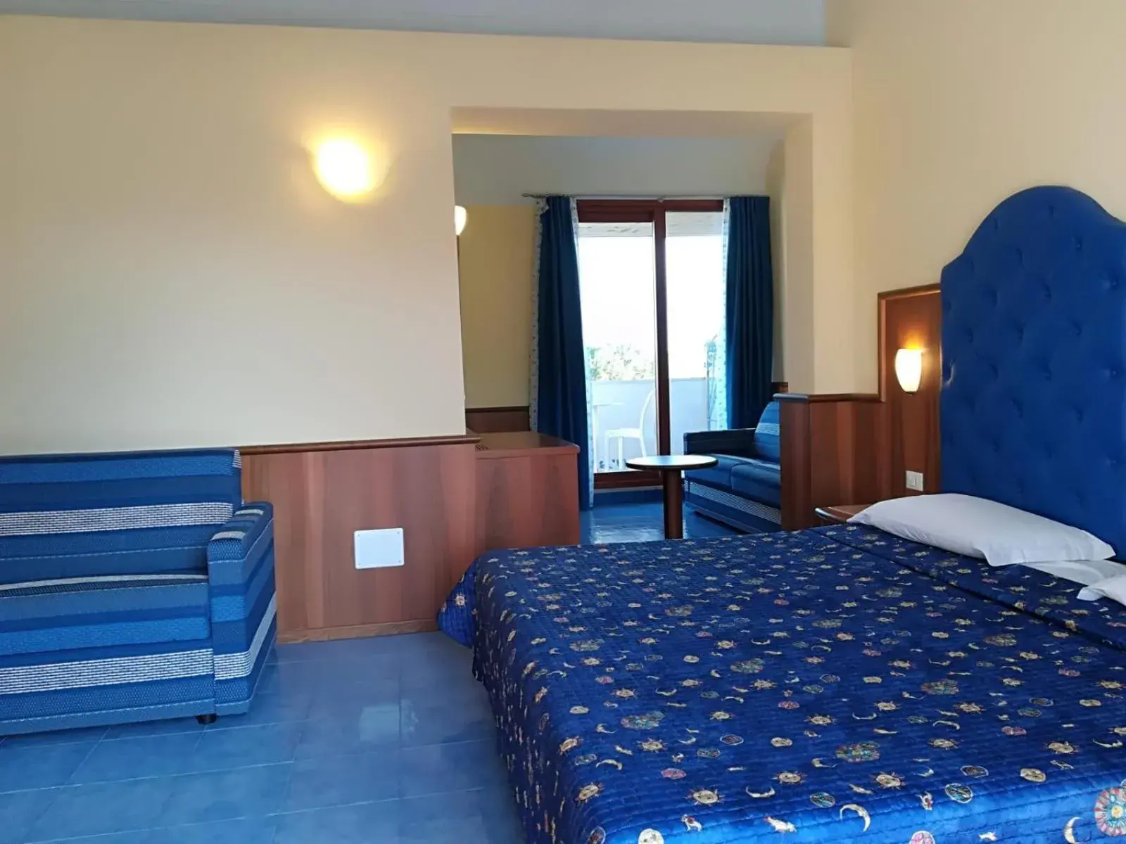 Bed in Kalos Hotel Bed in Kalos Hotel