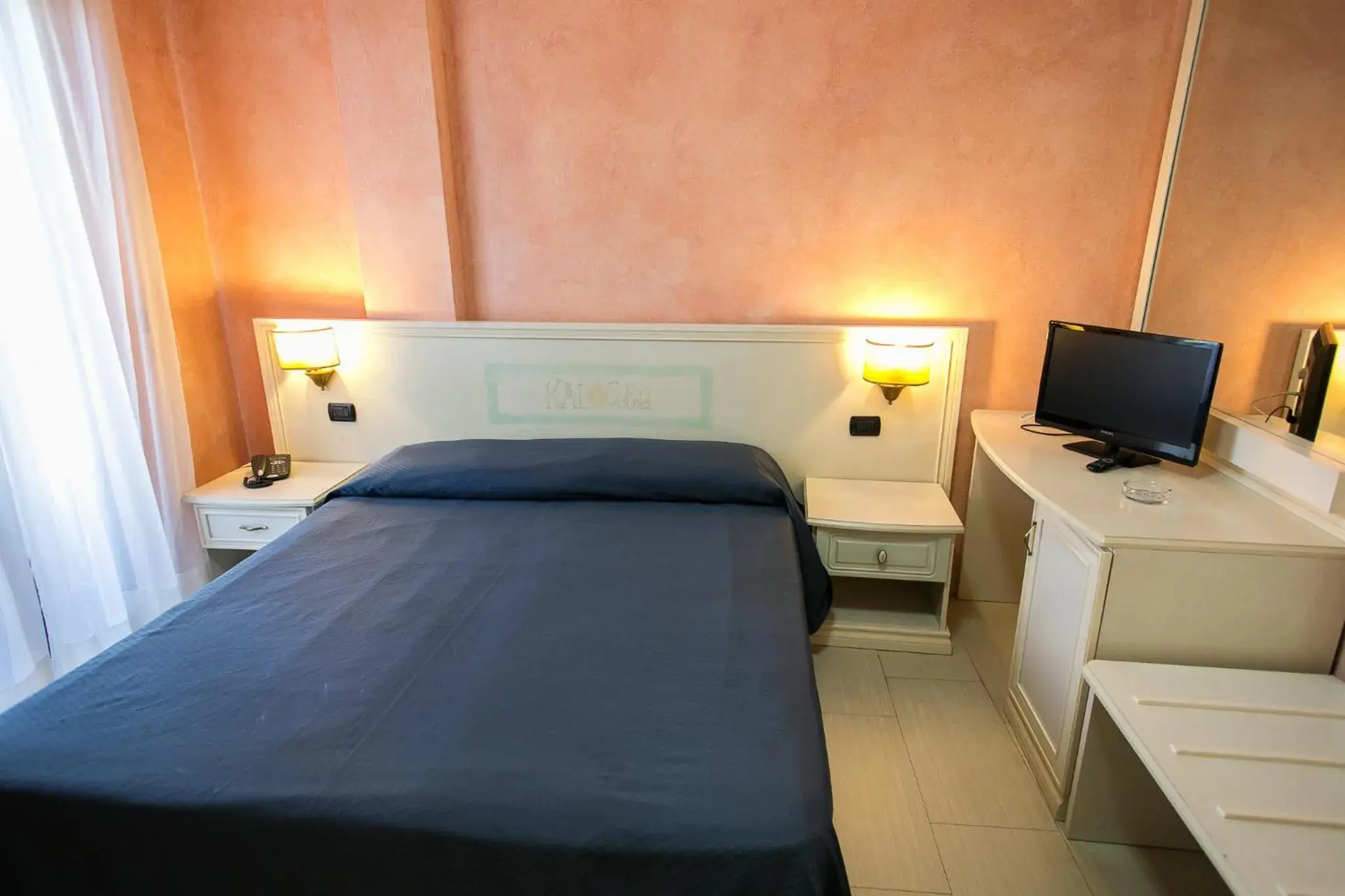 Bed in Kalos Hotel Bed in Kalos Hotel