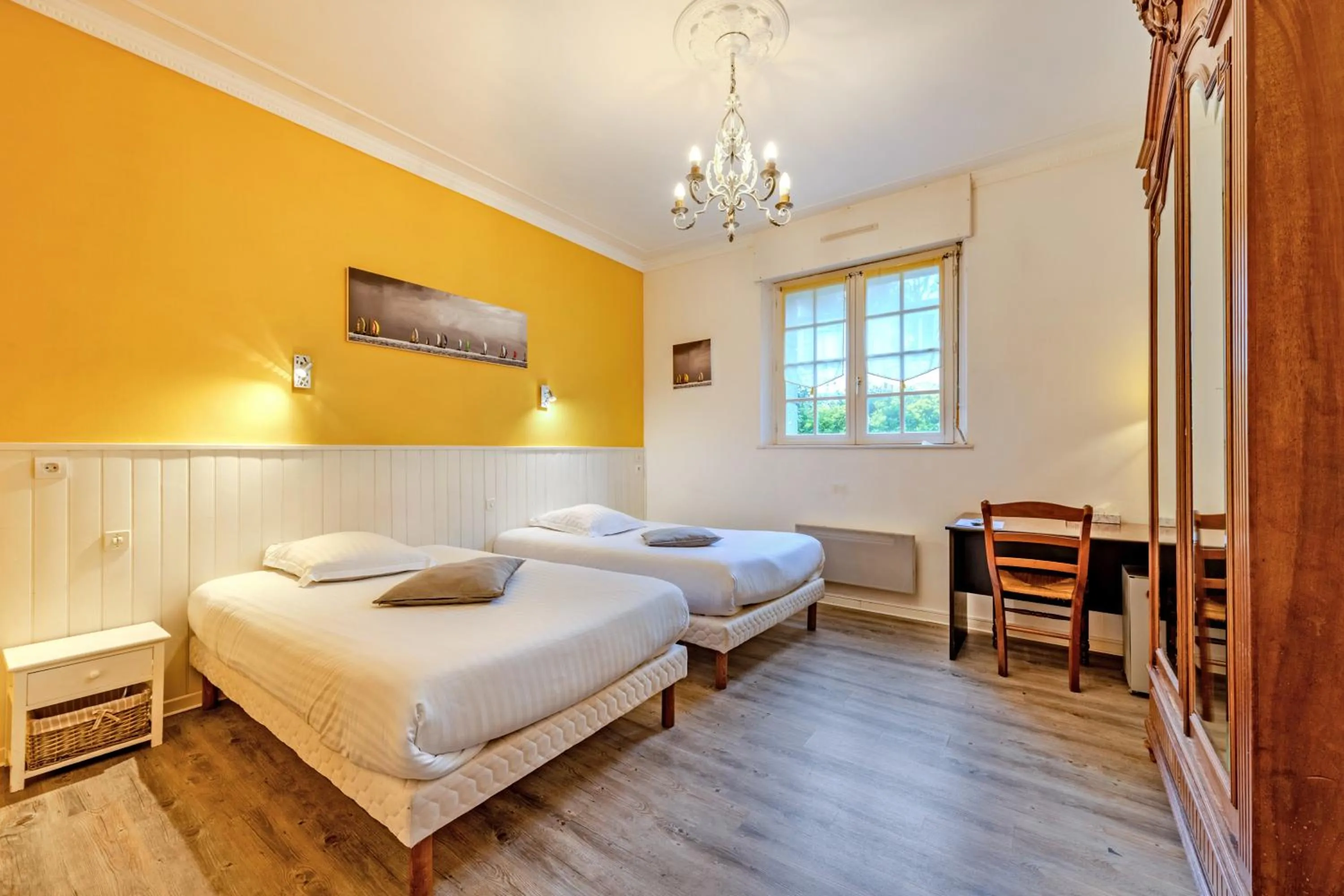 Bed in Logis Hotel De La Corniche