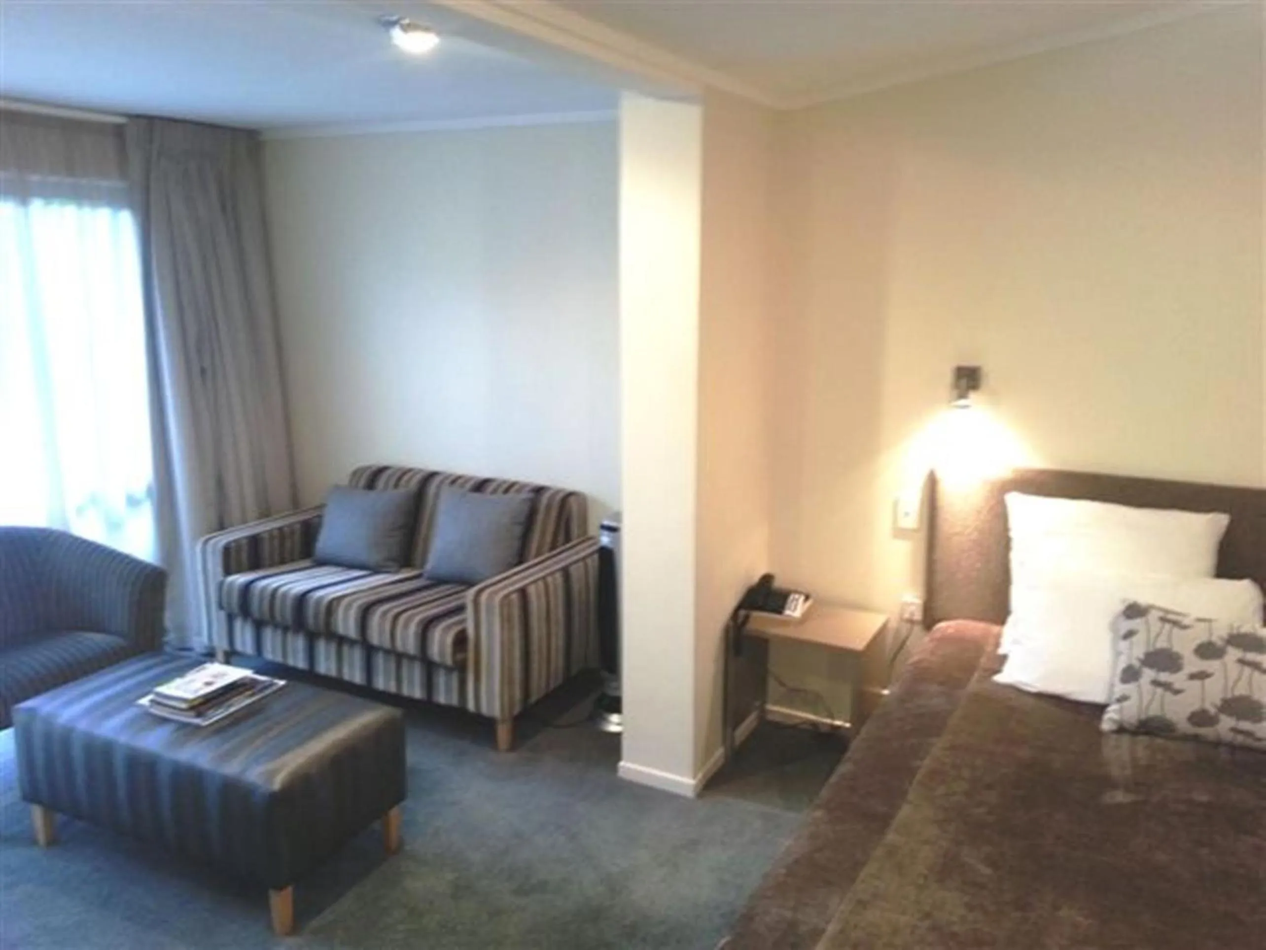 Seating area, Bed in Marineland Beachfront Accommodation