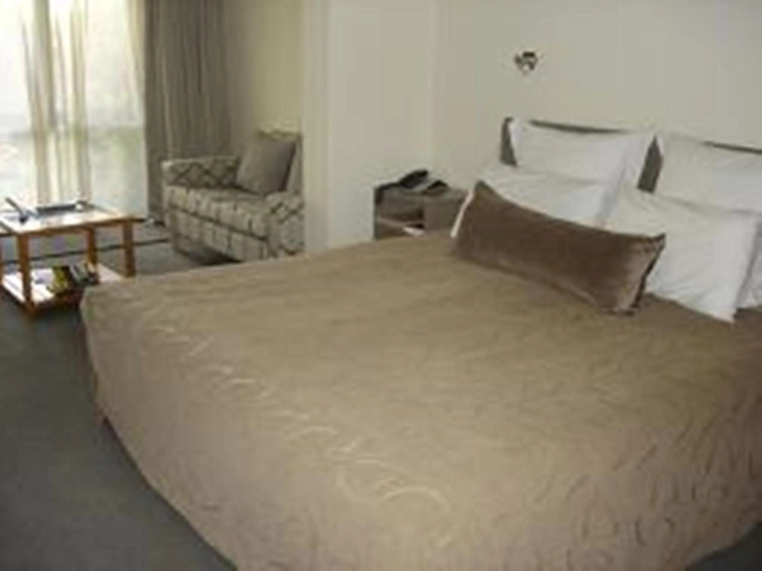 Seating area, Bed in Marineland Beachfront Accommodation