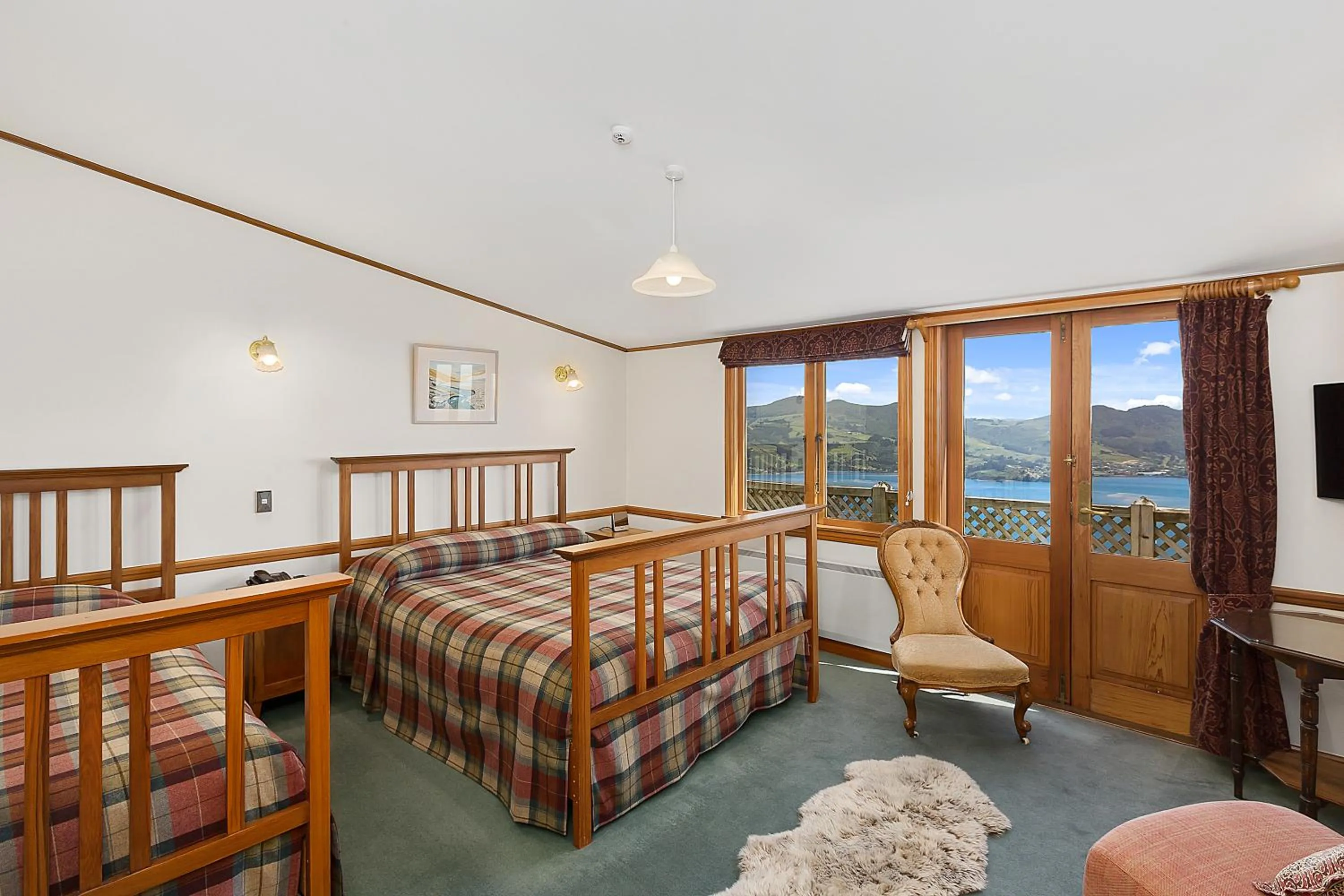 Bed in Larnach Lodge & Stable Stay