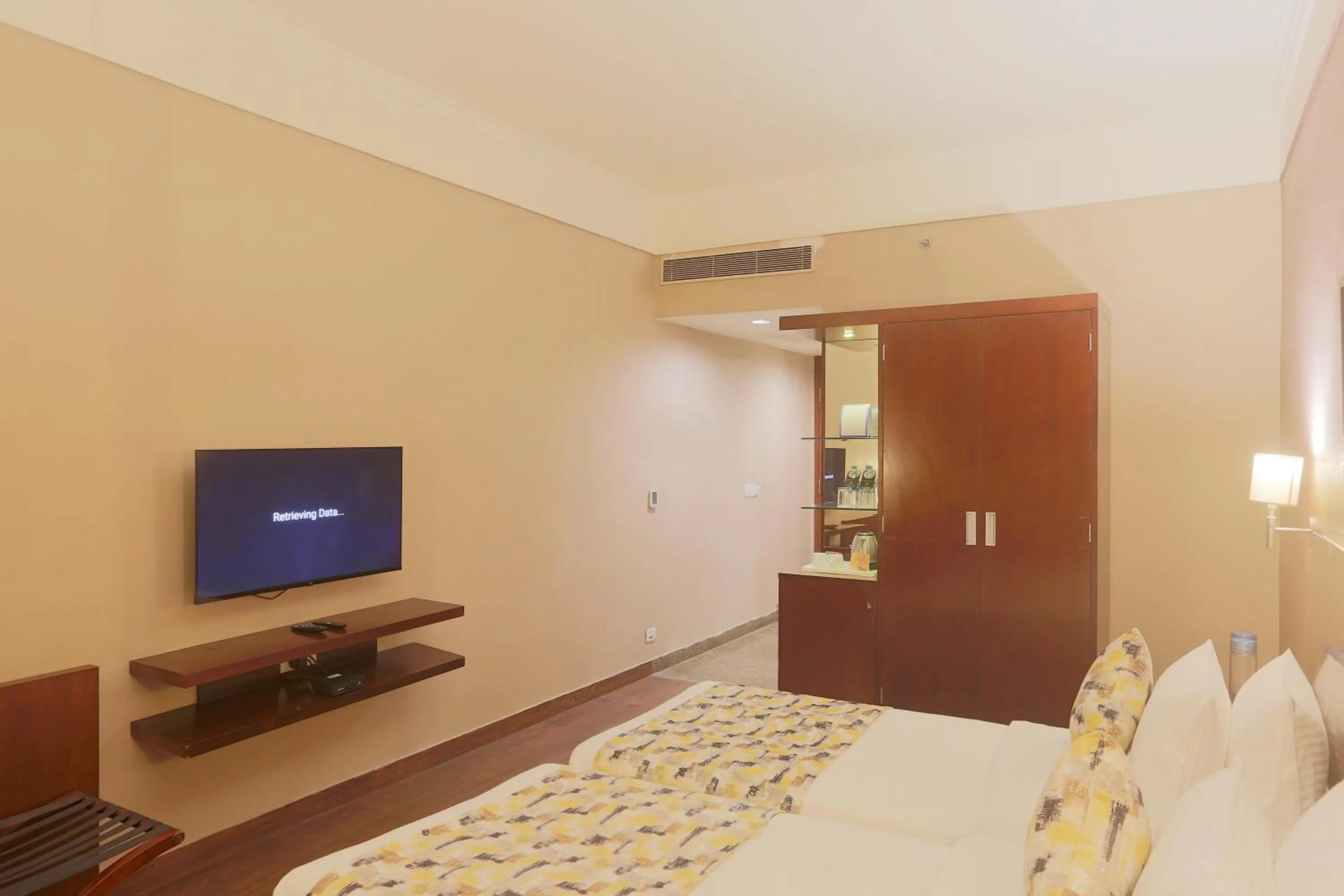 Communal lounge/ TV room, Bed in Vesta Maurya Palace