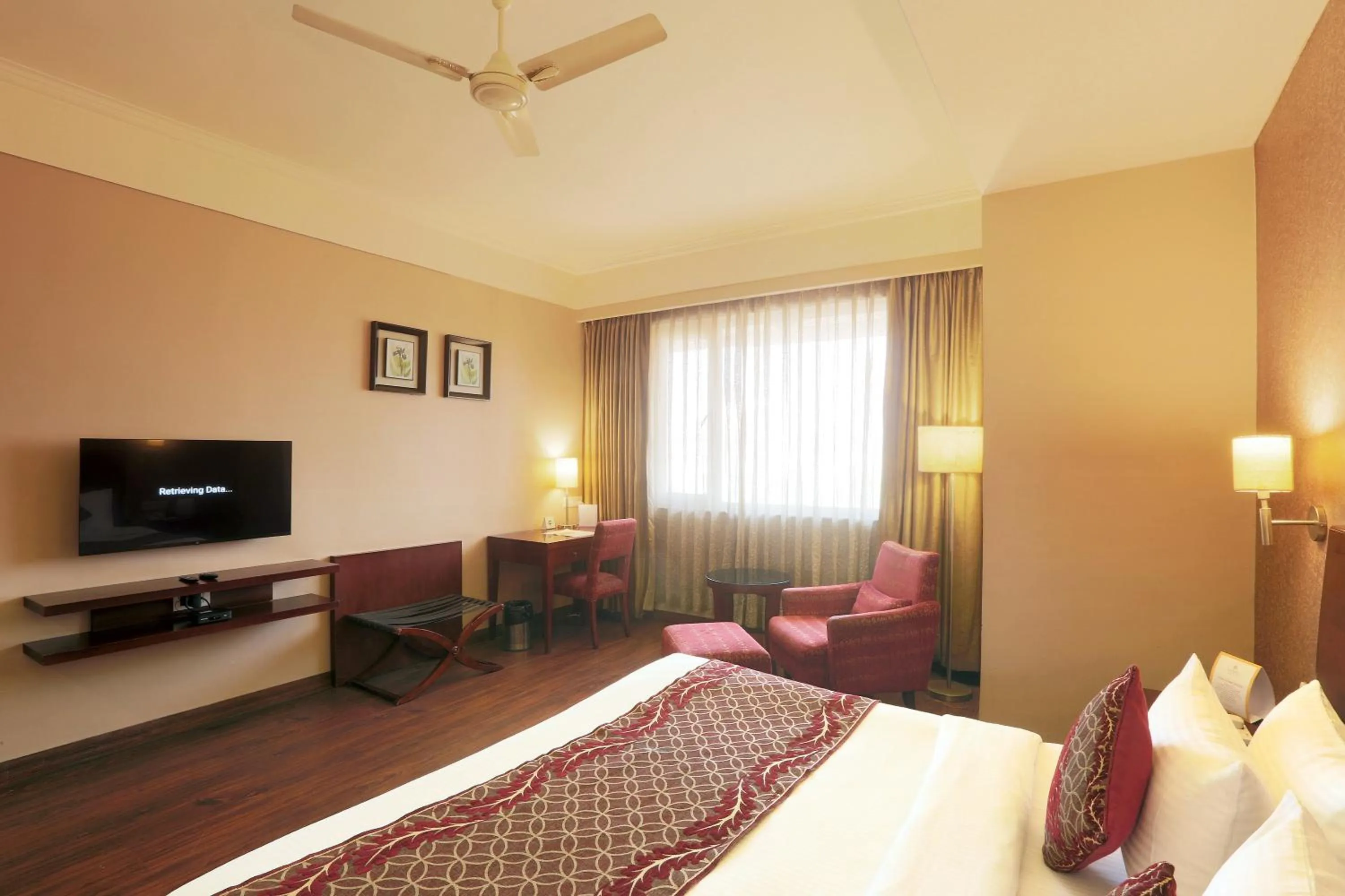 Communal lounge/ TV room, Bed in Vesta Maurya Palace