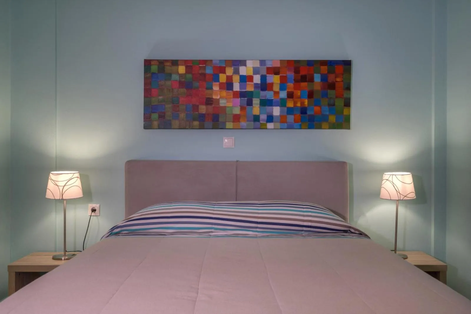 Bed in Stella in the Village Suites