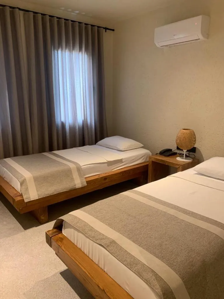 Bed in Bitez Corner Boutique Hotel