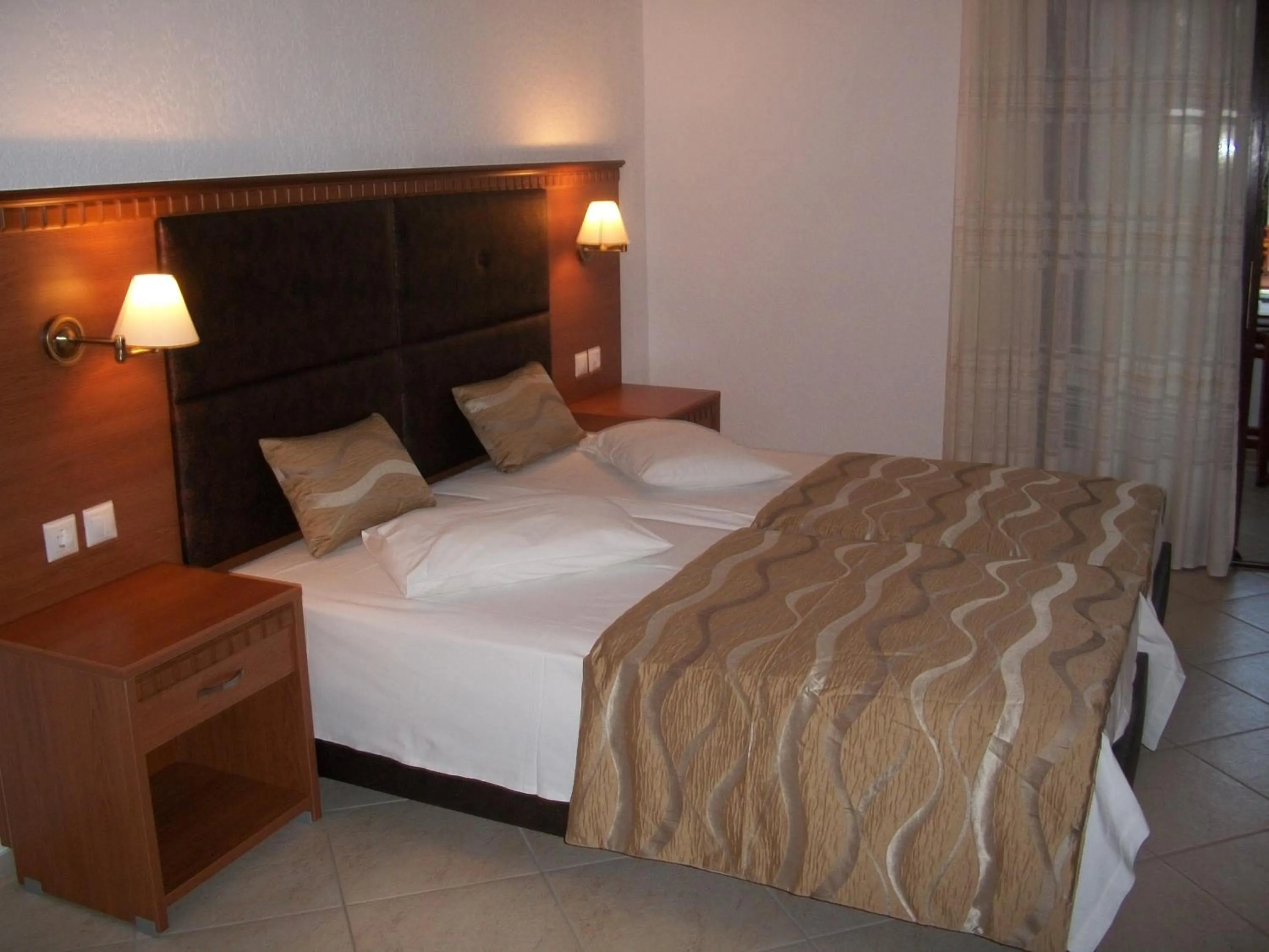 Bed in Hotel Filoxenia