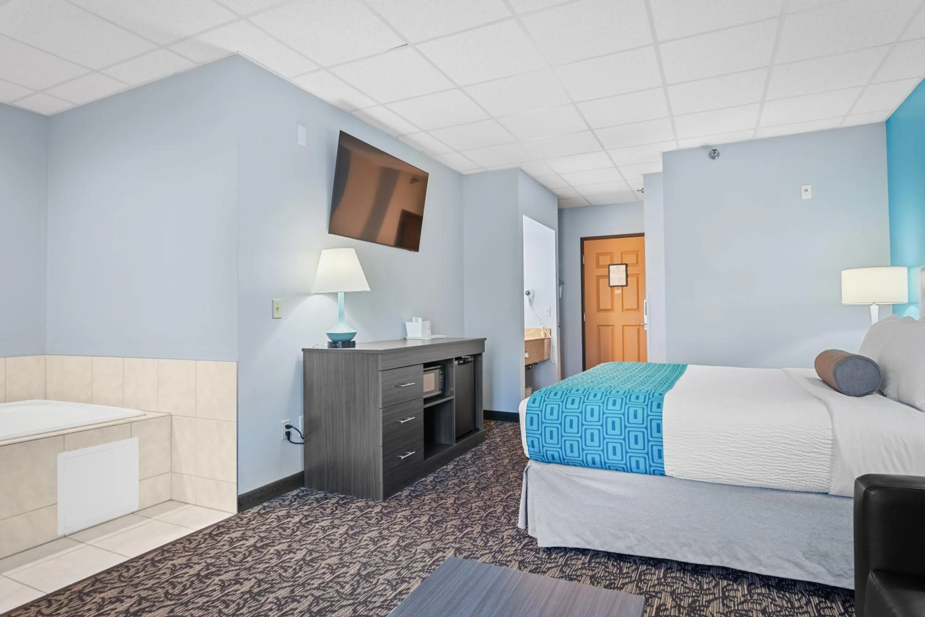 Bed in Elevation Inn & Suites, Trademark Collection by Wyndham