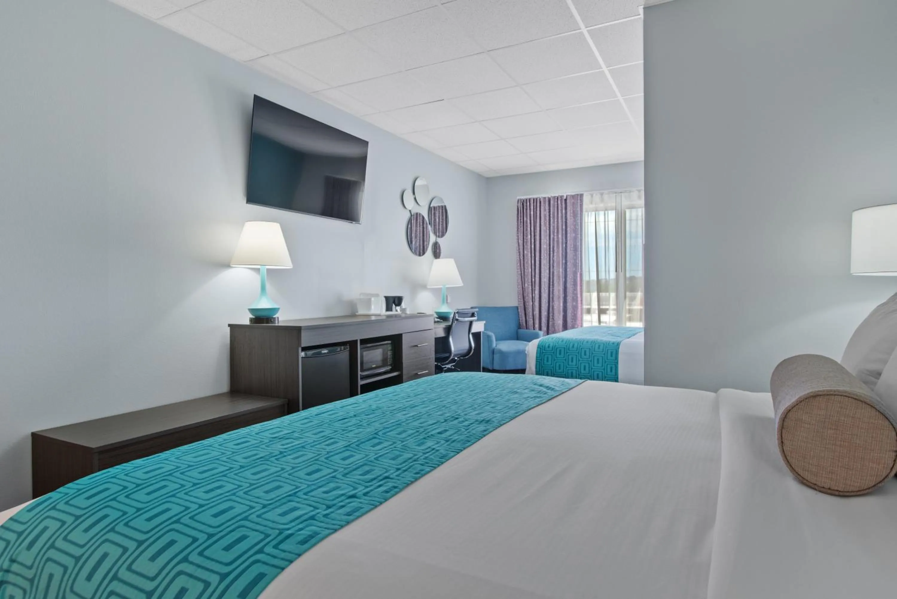 Bed in Elevation Inn & Suites, Trademark Collection by Wyndham