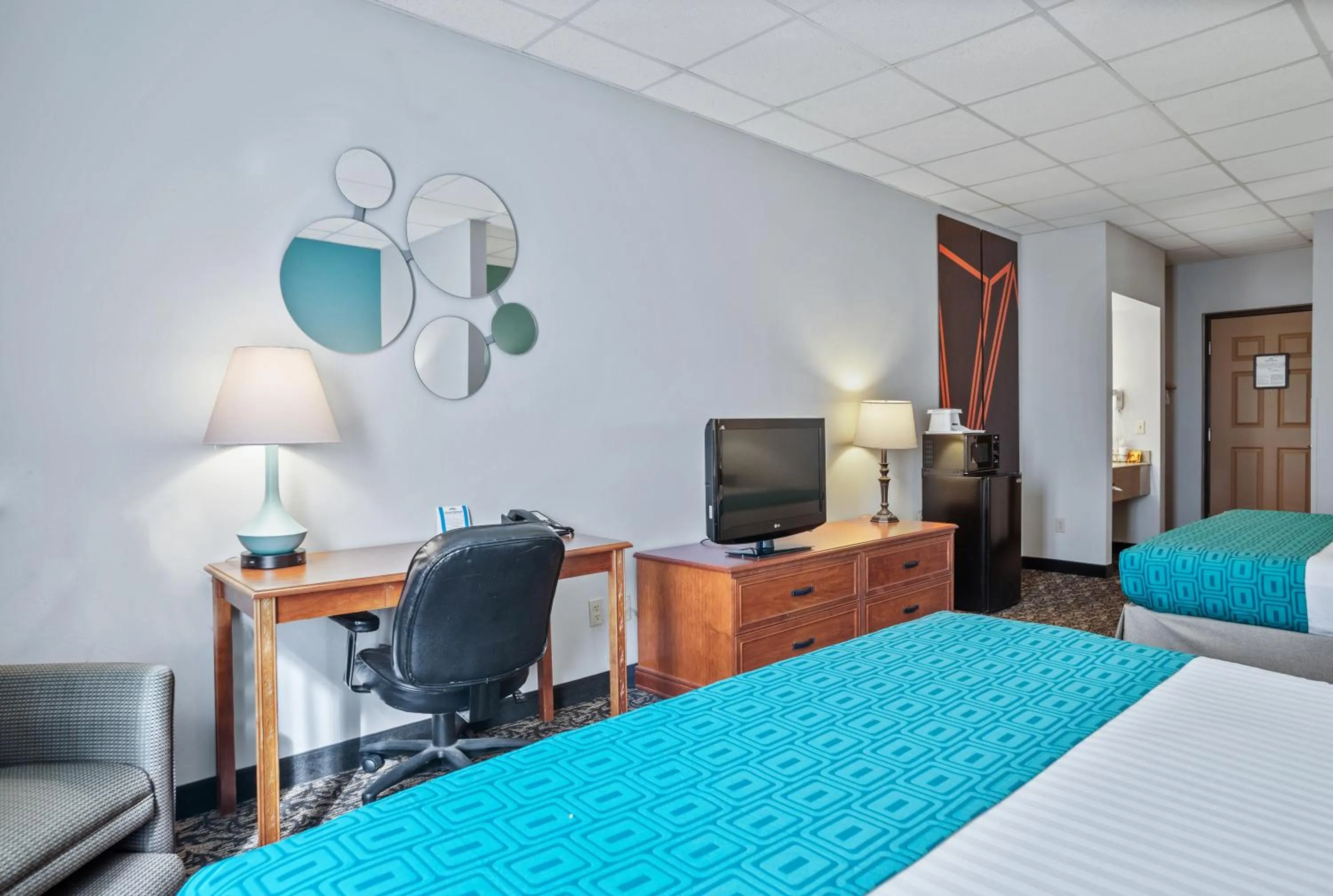 Bed in Elevation Inn & Suites, Trademark Collection by Wyndham