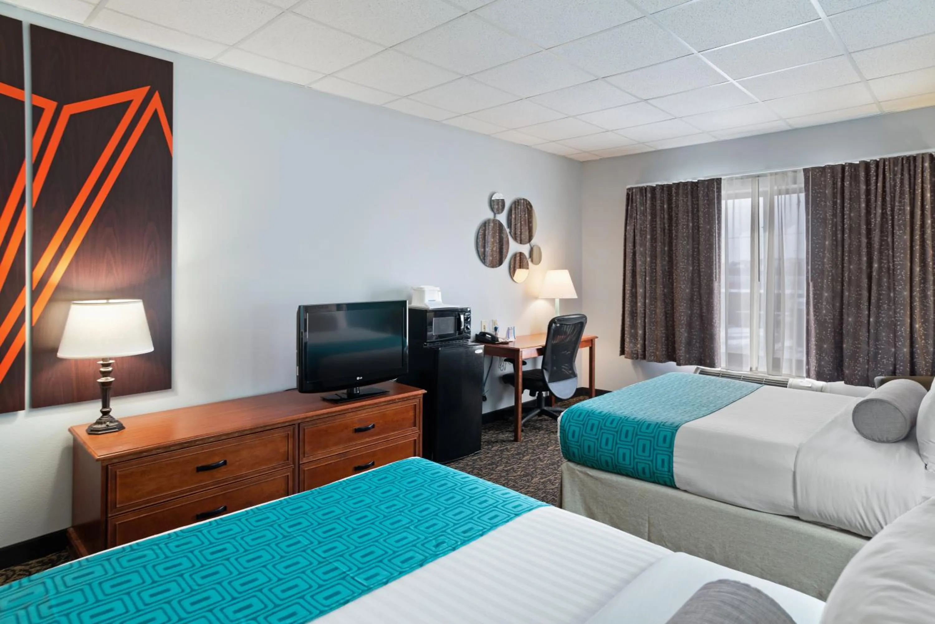 Bed in Elevation Inn & Suites, Trademark Collection by Wyndham