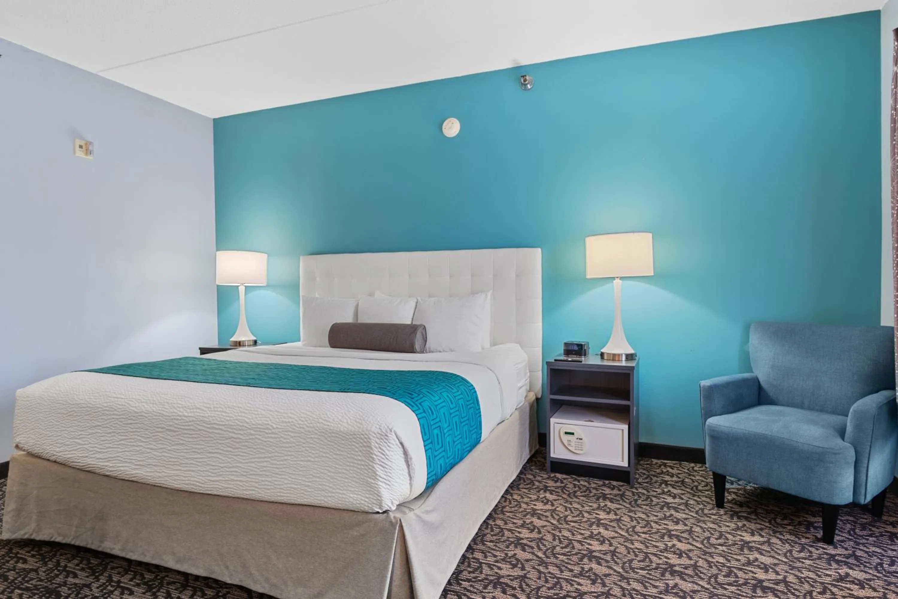 Bed in Elevation Inn & Suites, Trademark Collection by Wyndham