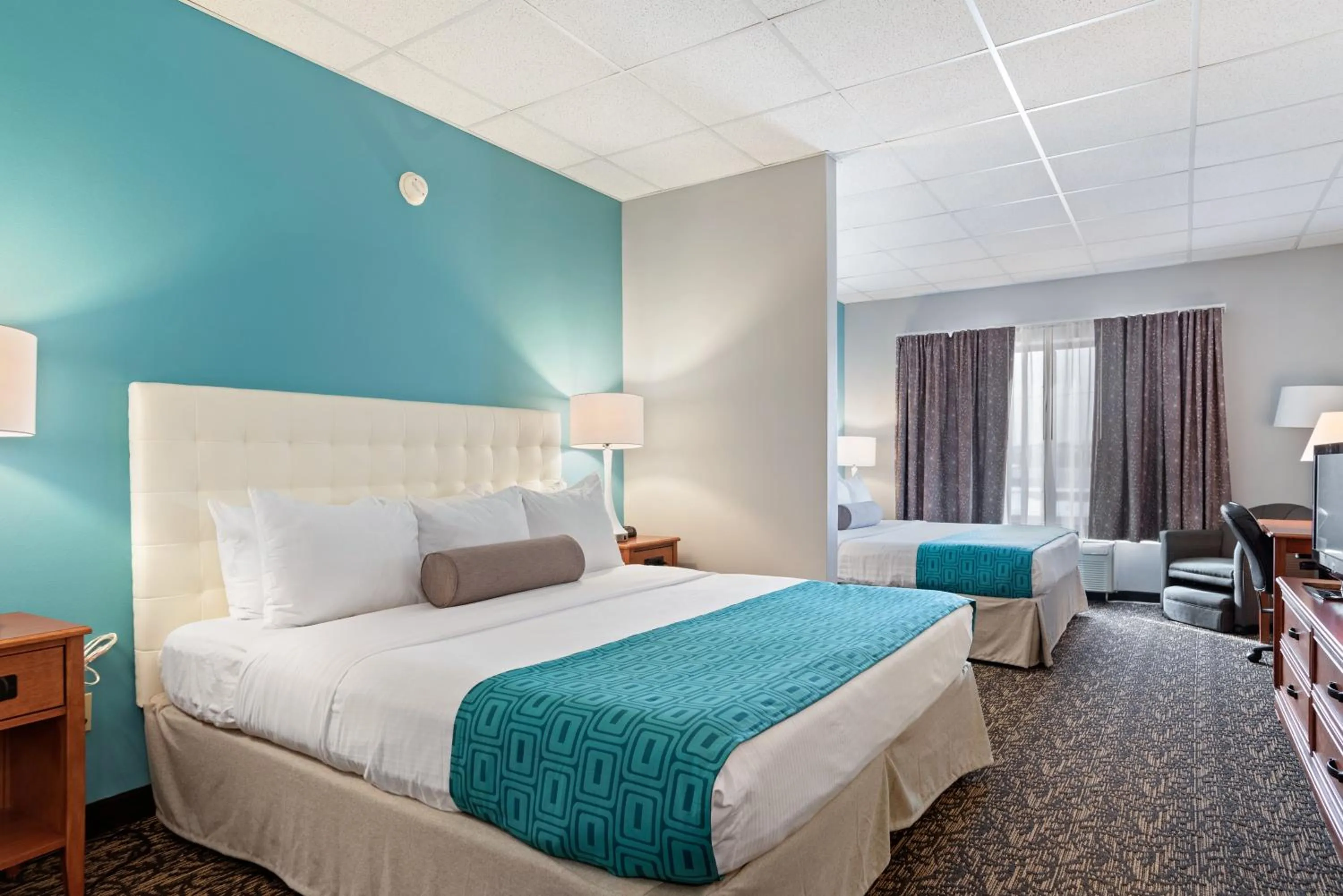 Bed in Elevation Inn & Suites, Trademark Collection by Wyndham