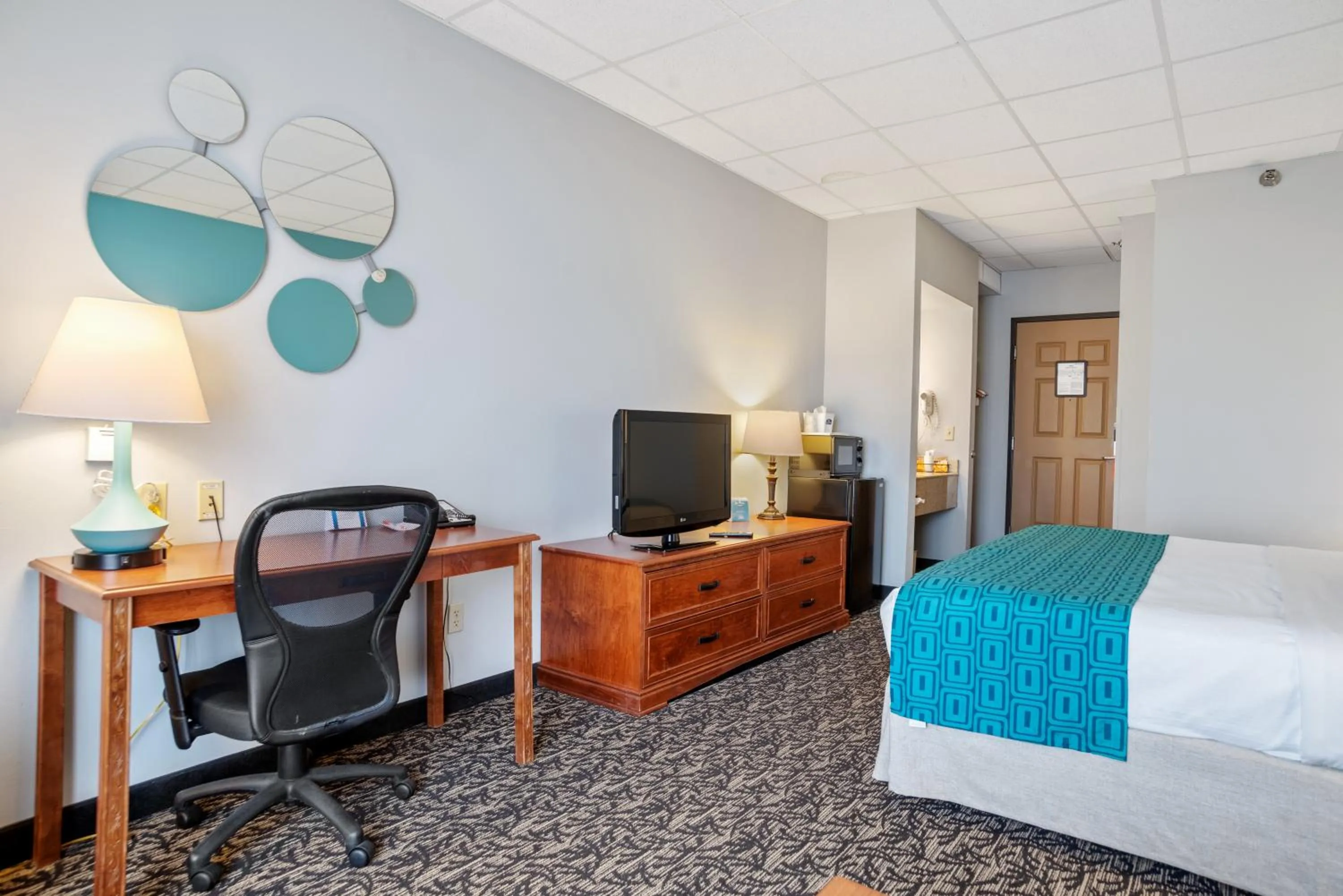 Bed in Elevation Inn & Suites, Trademark Collection by Wyndham