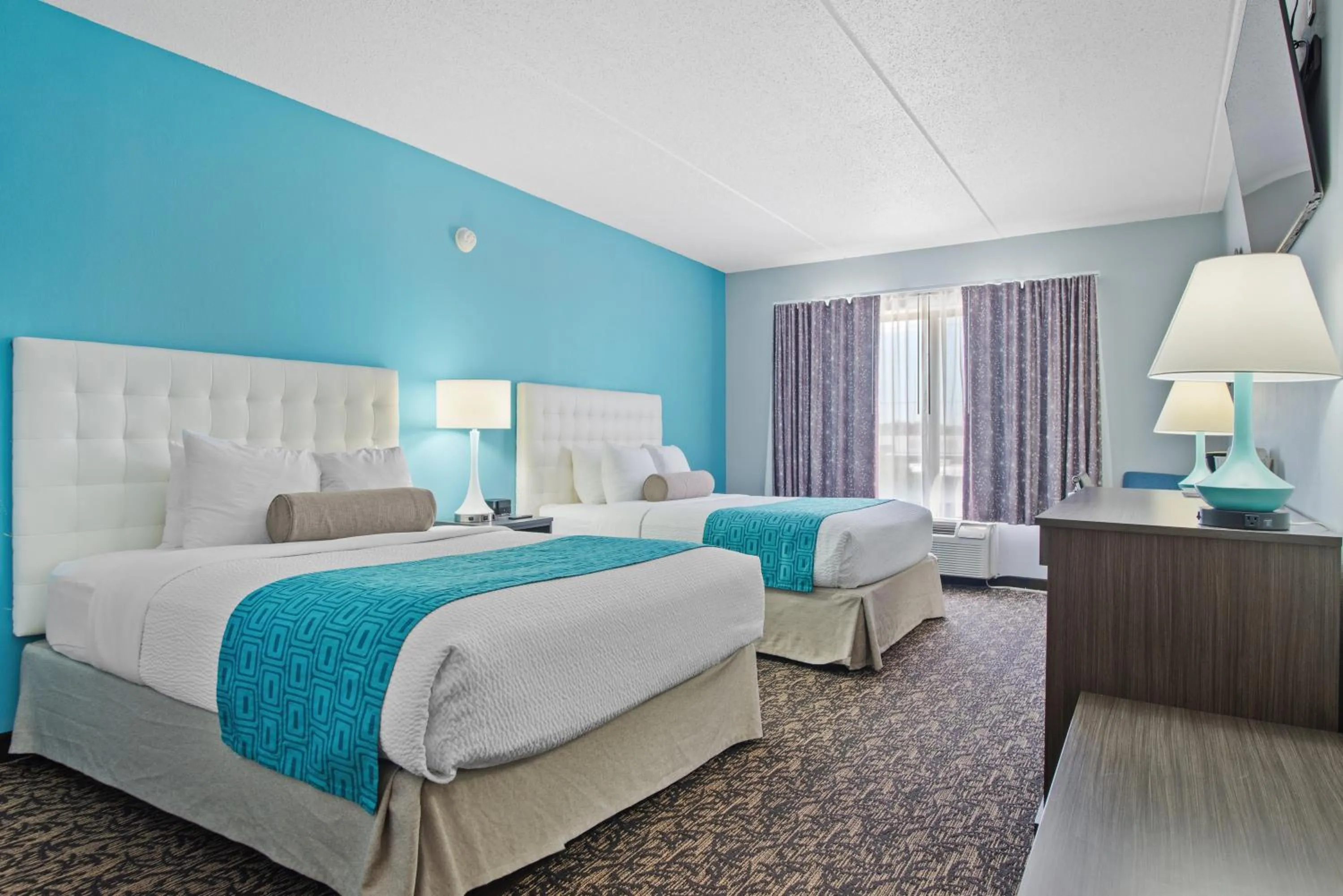 Bed in Elevation Inn & Suites, Trademark Collection by Wyndham