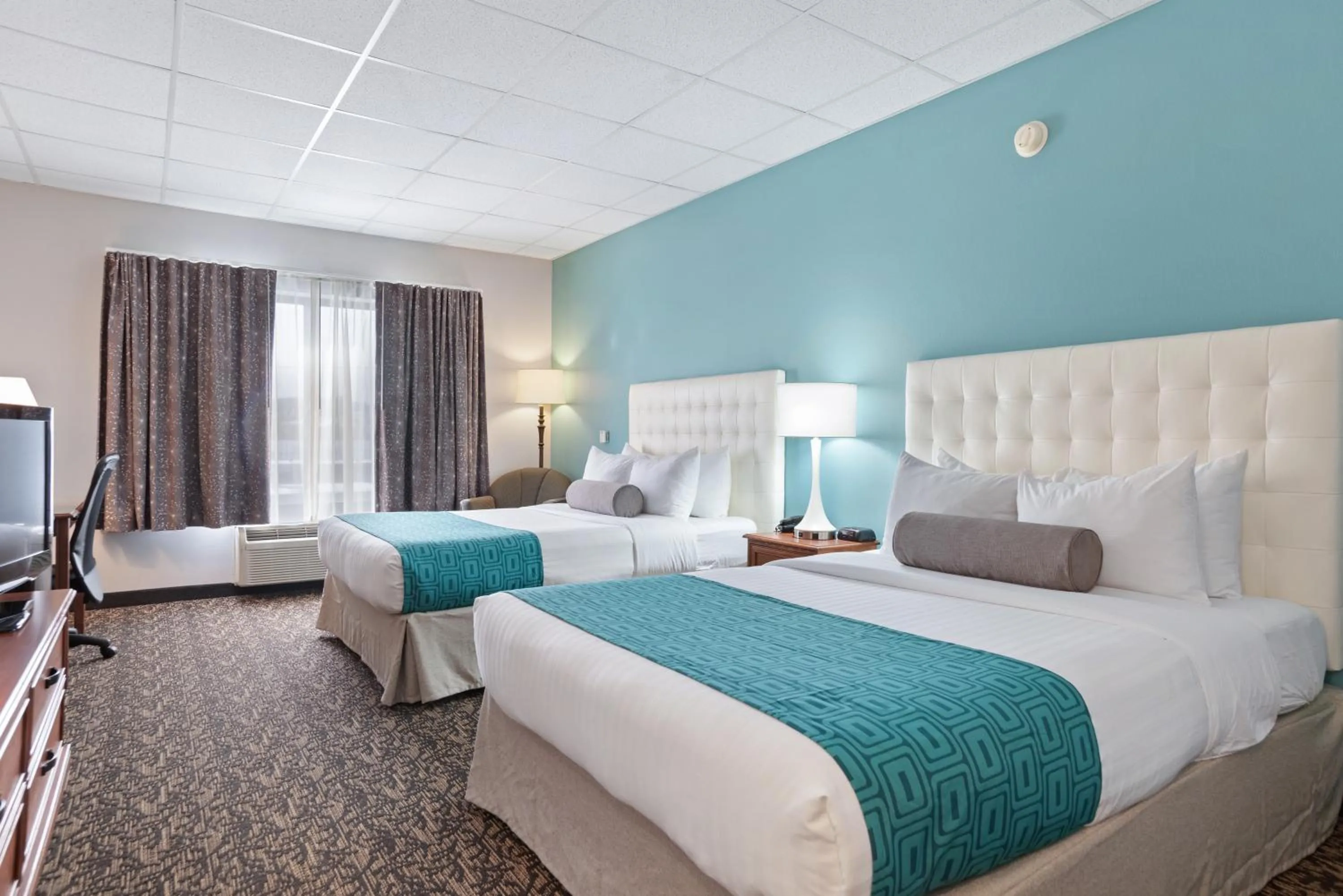 Bed in Elevation Inn & Suites, Trademark Collection by Wyndham