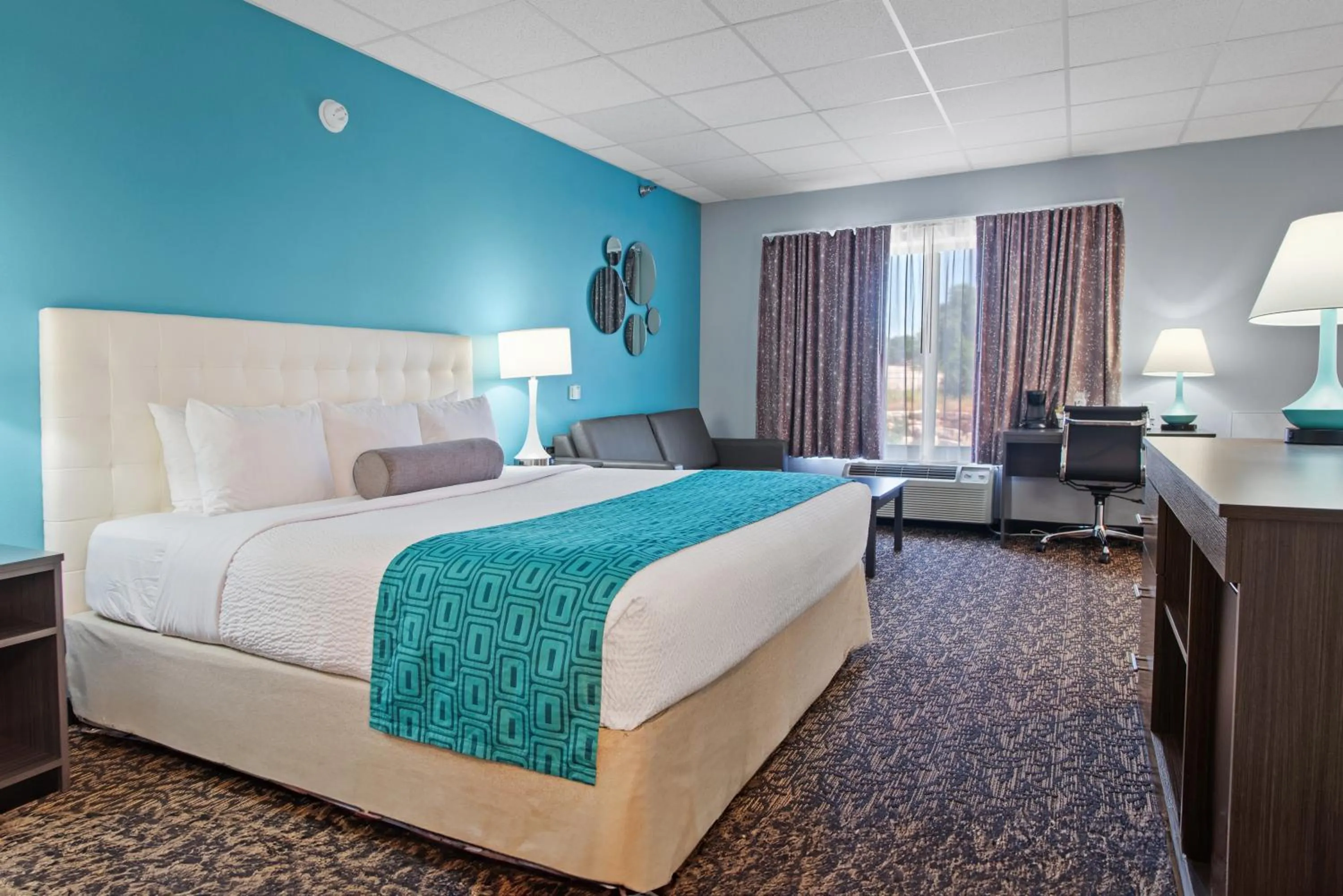 Bed in Elevation Inn & Suites, Trademark Collection by Wyndham