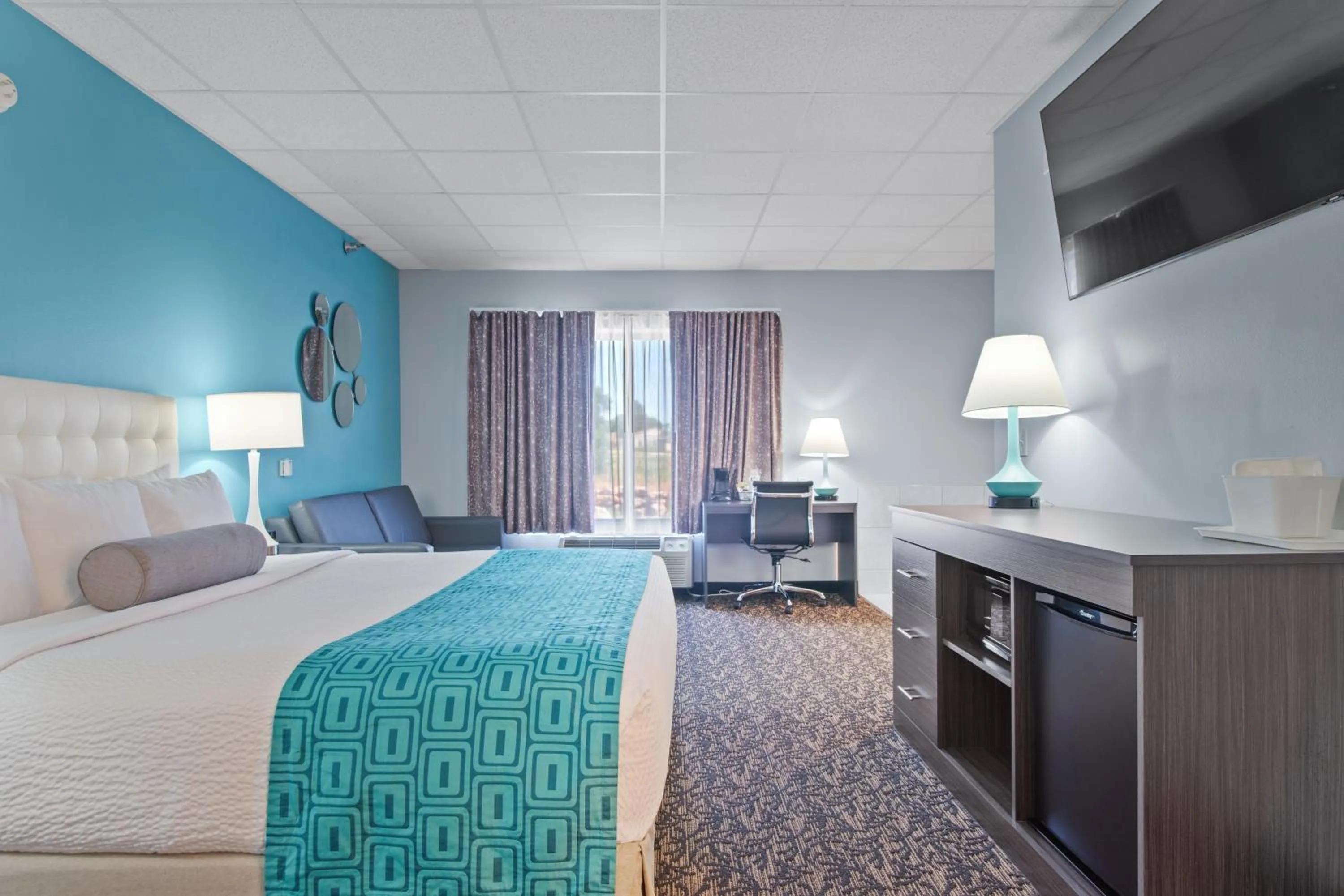 Bed in Elevation Inn & Suites, Trademark Collection by Wyndham