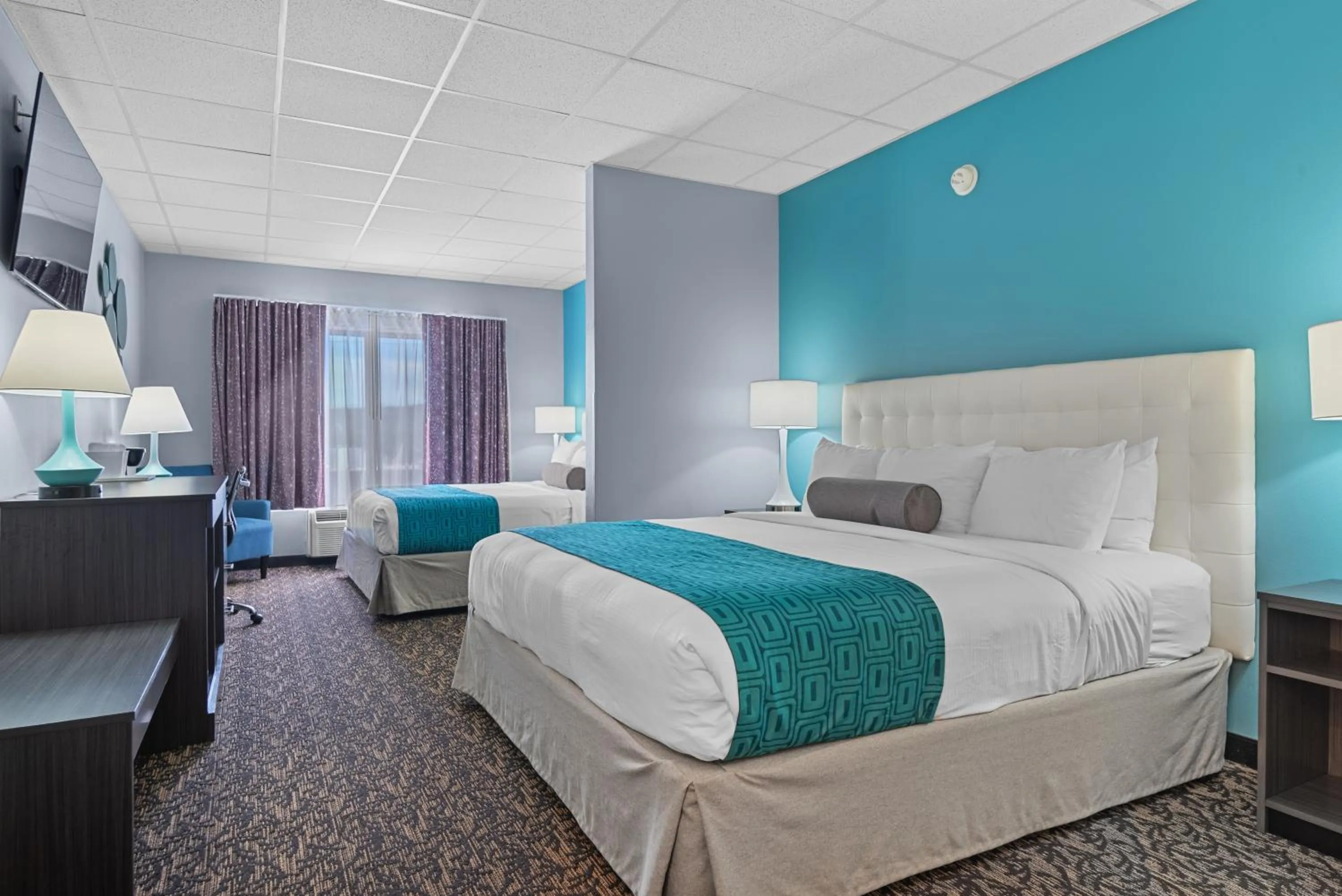 Bed in Elevation Inn & Suites, Trademark Collection by Wyndham