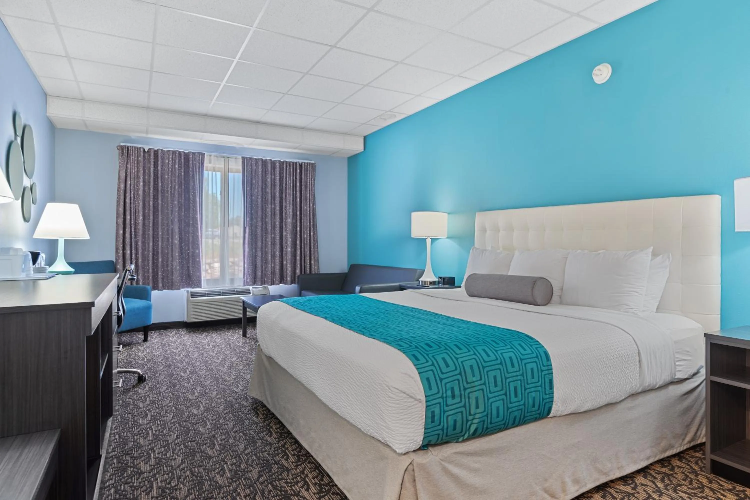 Bed in Elevation Inn & Suites, Trademark Collection by Wyndham