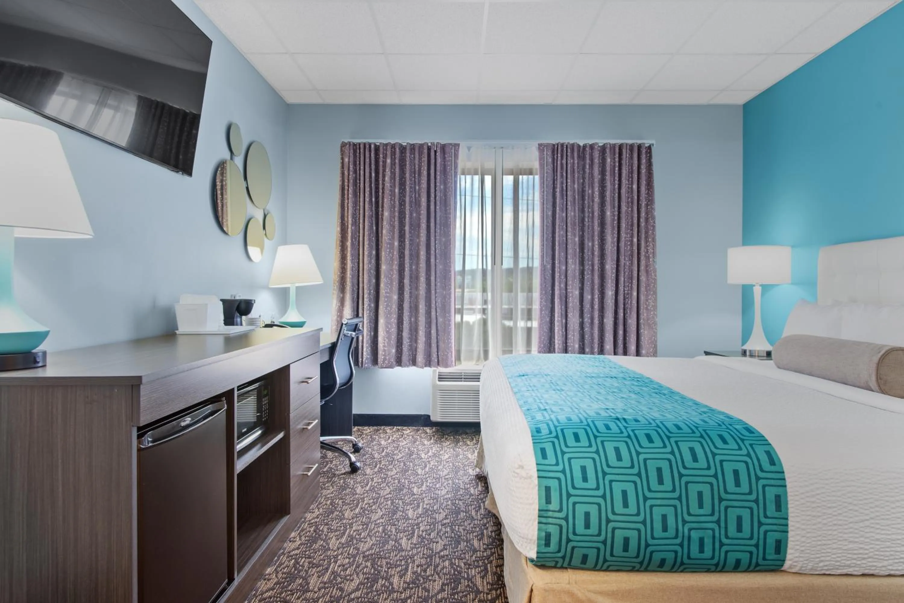 Bed in Elevation Inn & Suites, Trademark Collection by Wyndham