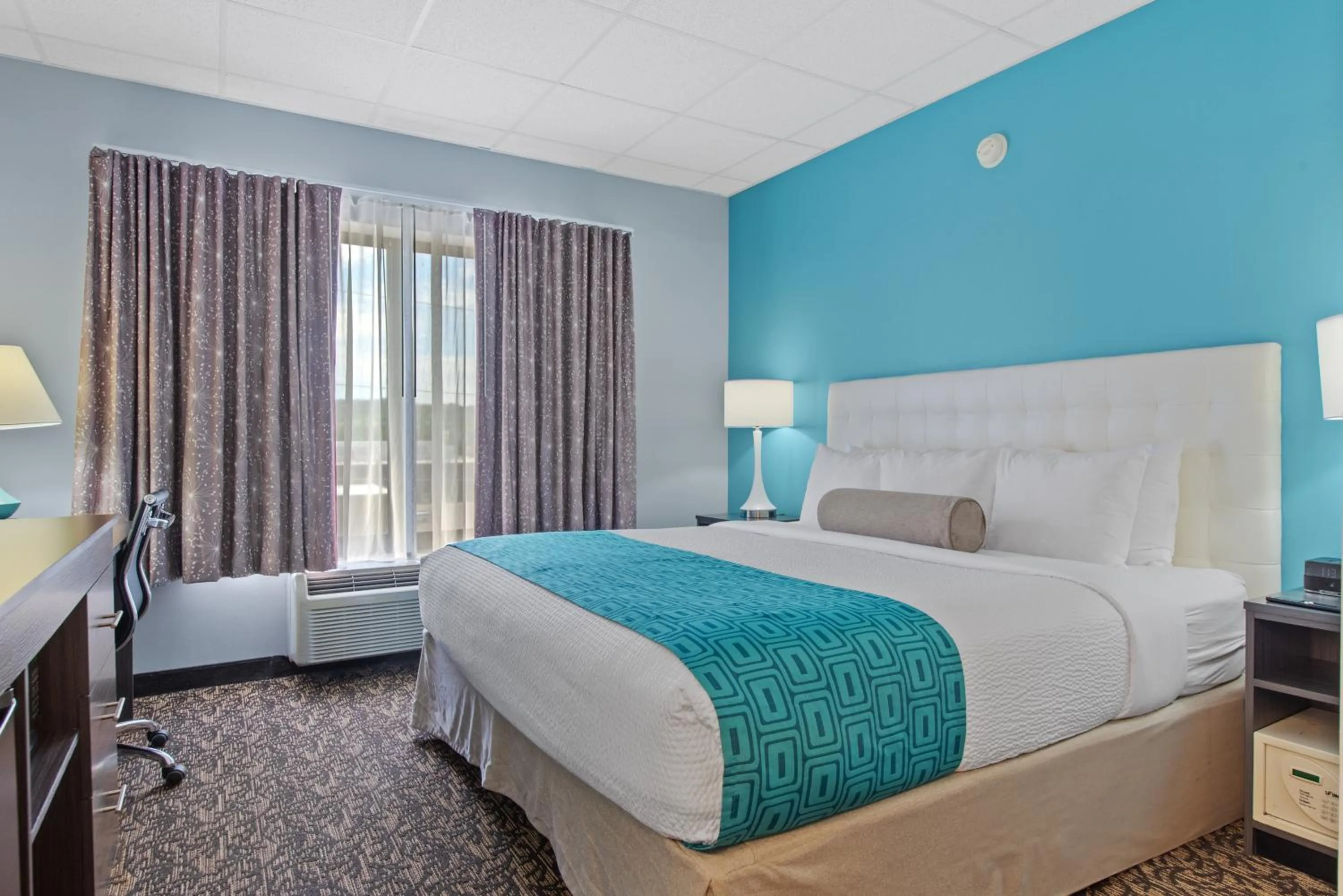 Bed in Elevation Inn & Suites, Trademark Collection by Wyndham