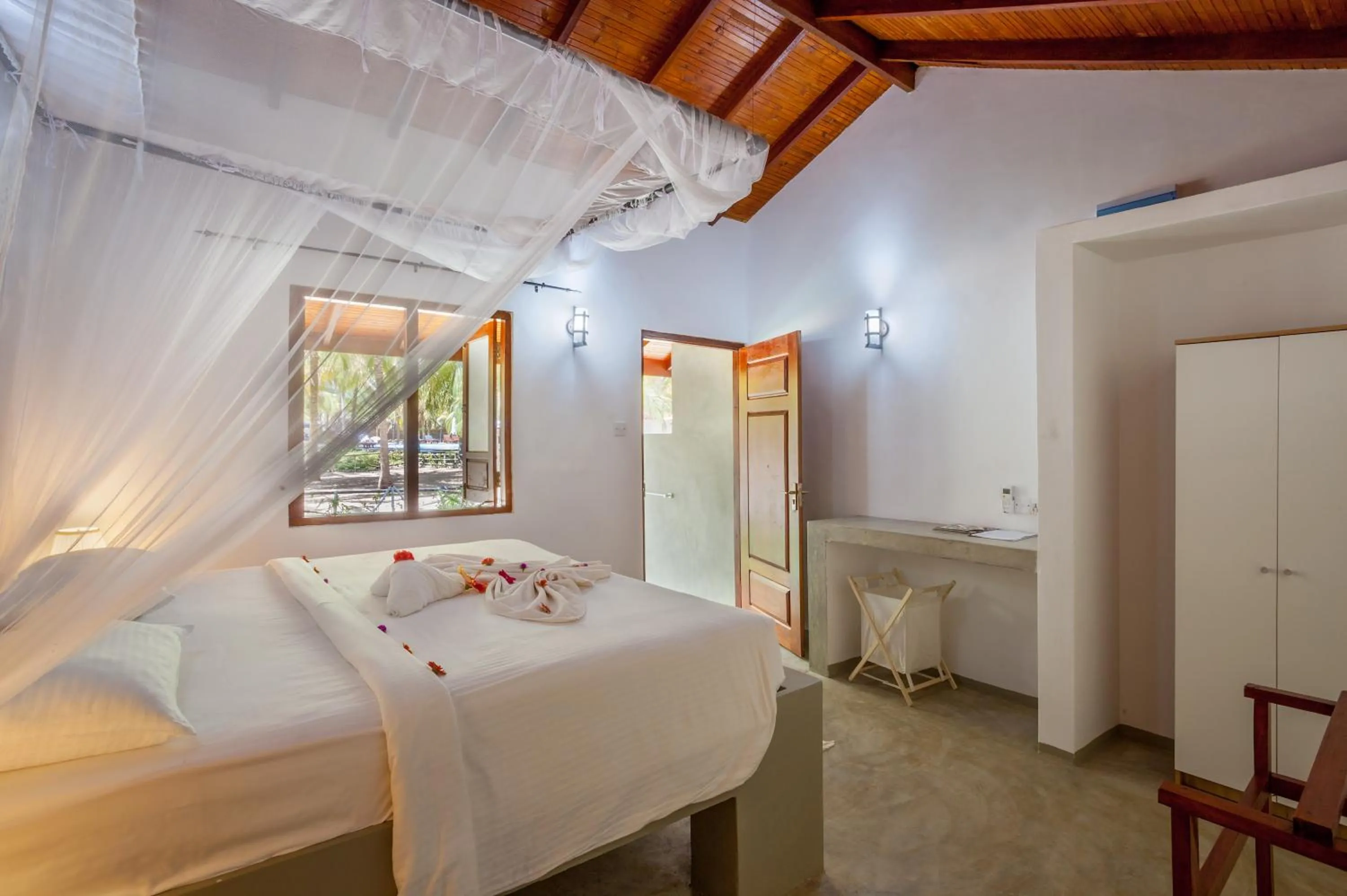 Bed in De Silva Palm Resort