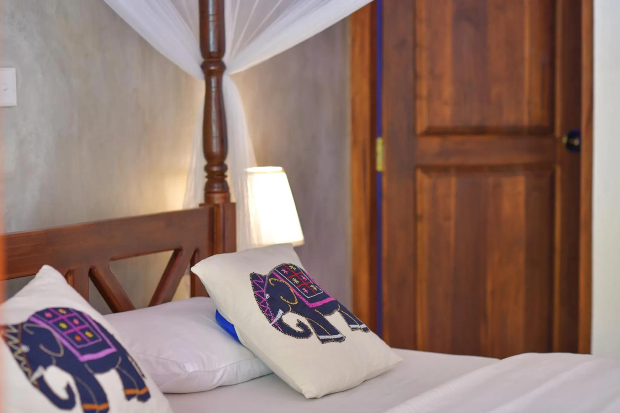 Bed in De Silva Palm Resort