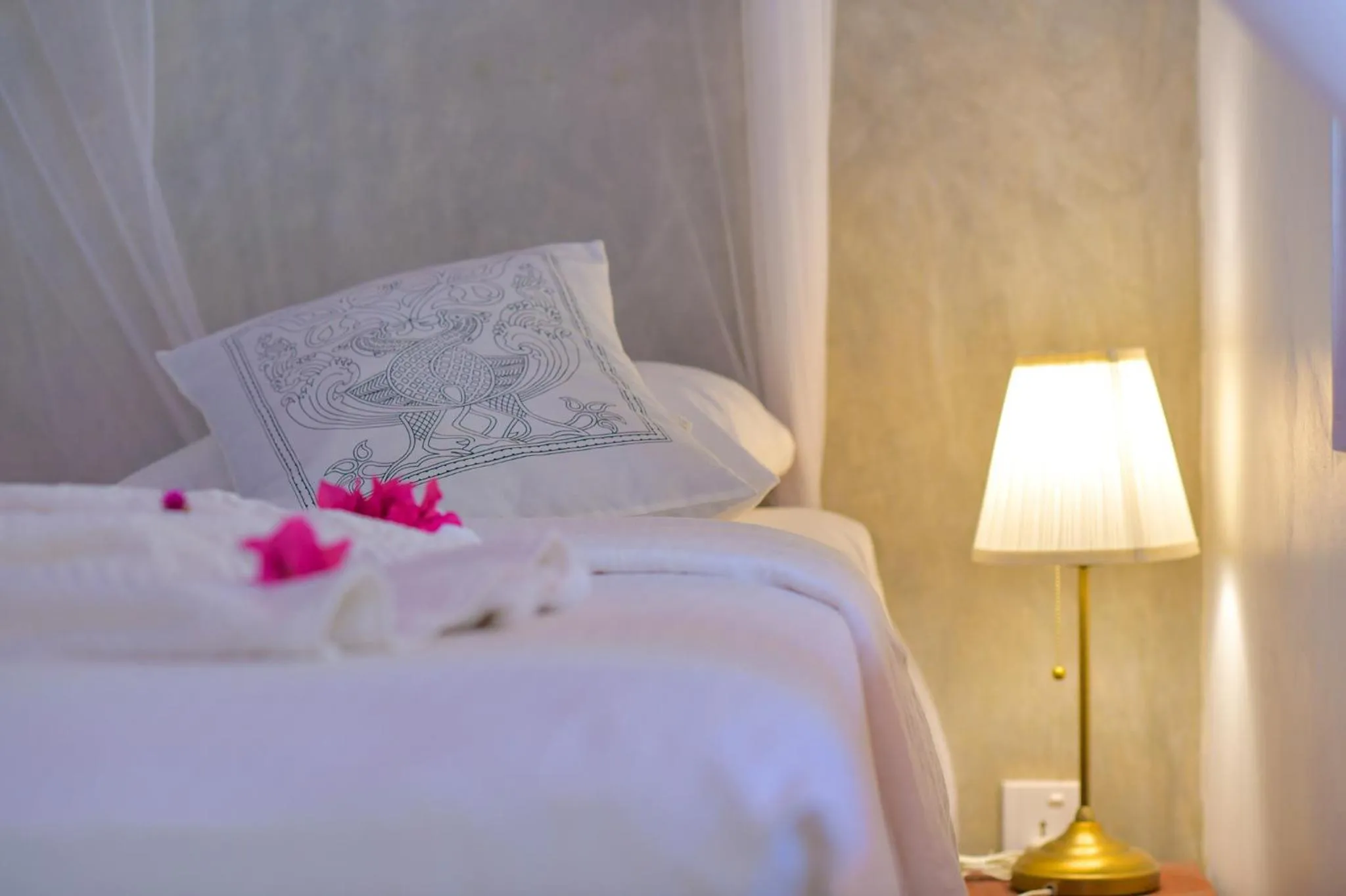 Bed in De Silva Palm Resort