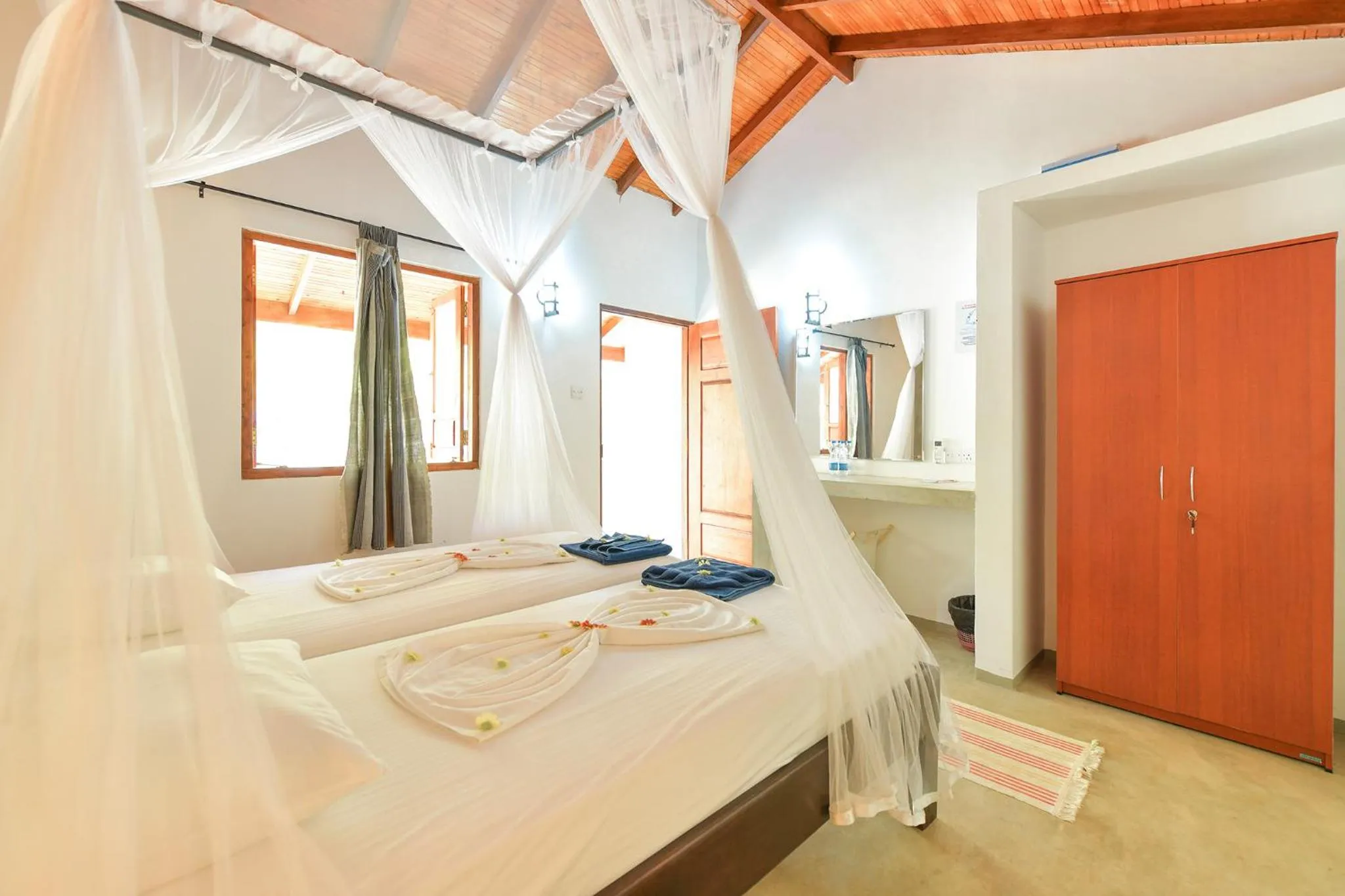 Bed in De Silva Palm Resort