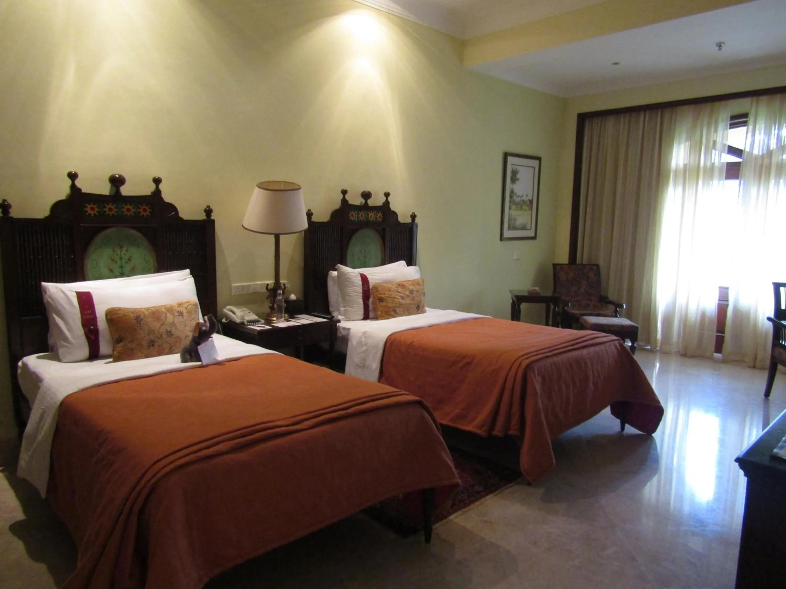 Pool view, Bed in The LaLiT Golf & Spa Resort Goa