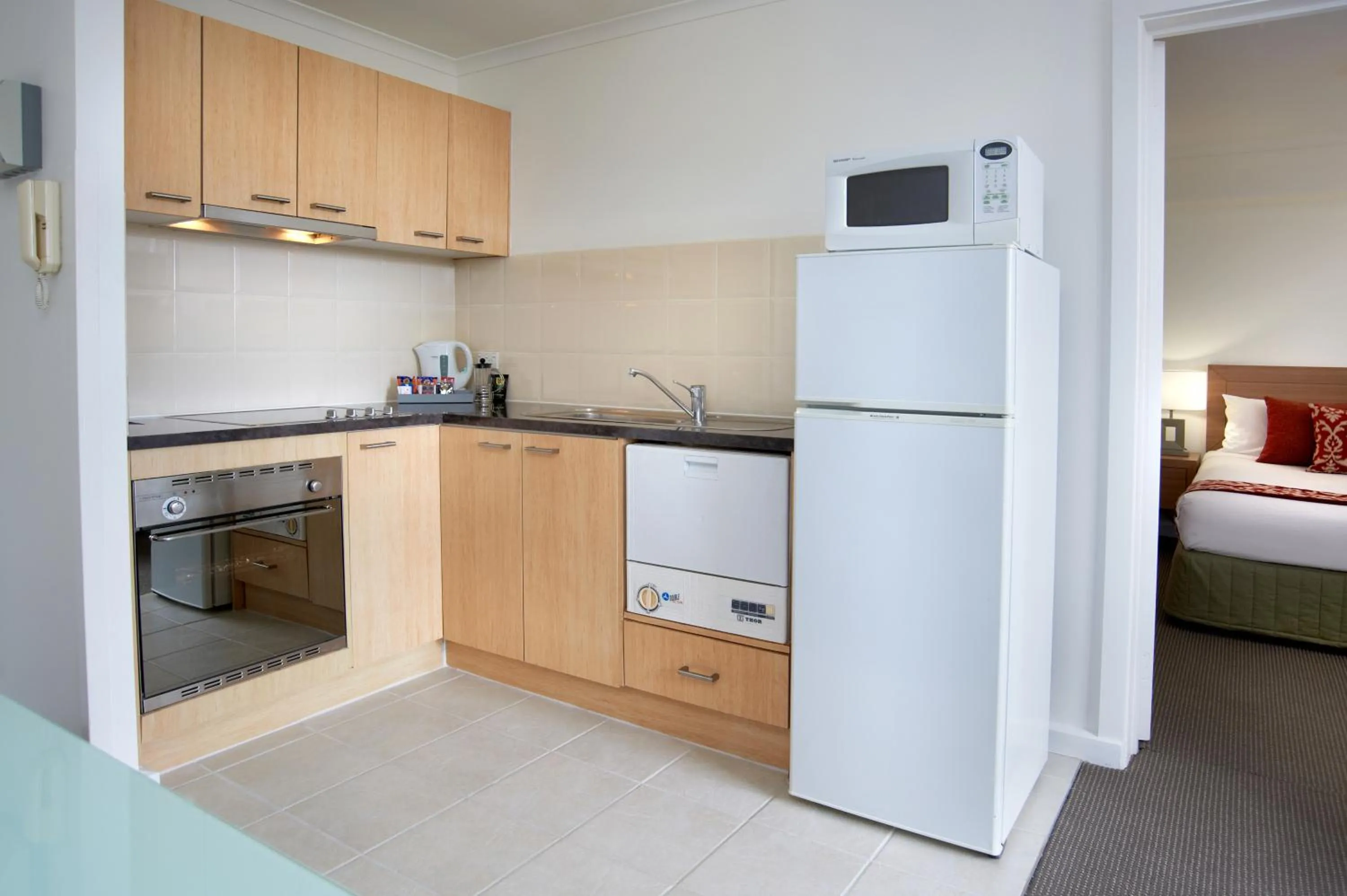 Kitchen or kitchenette, Bed in Quest St Kilda Bayside