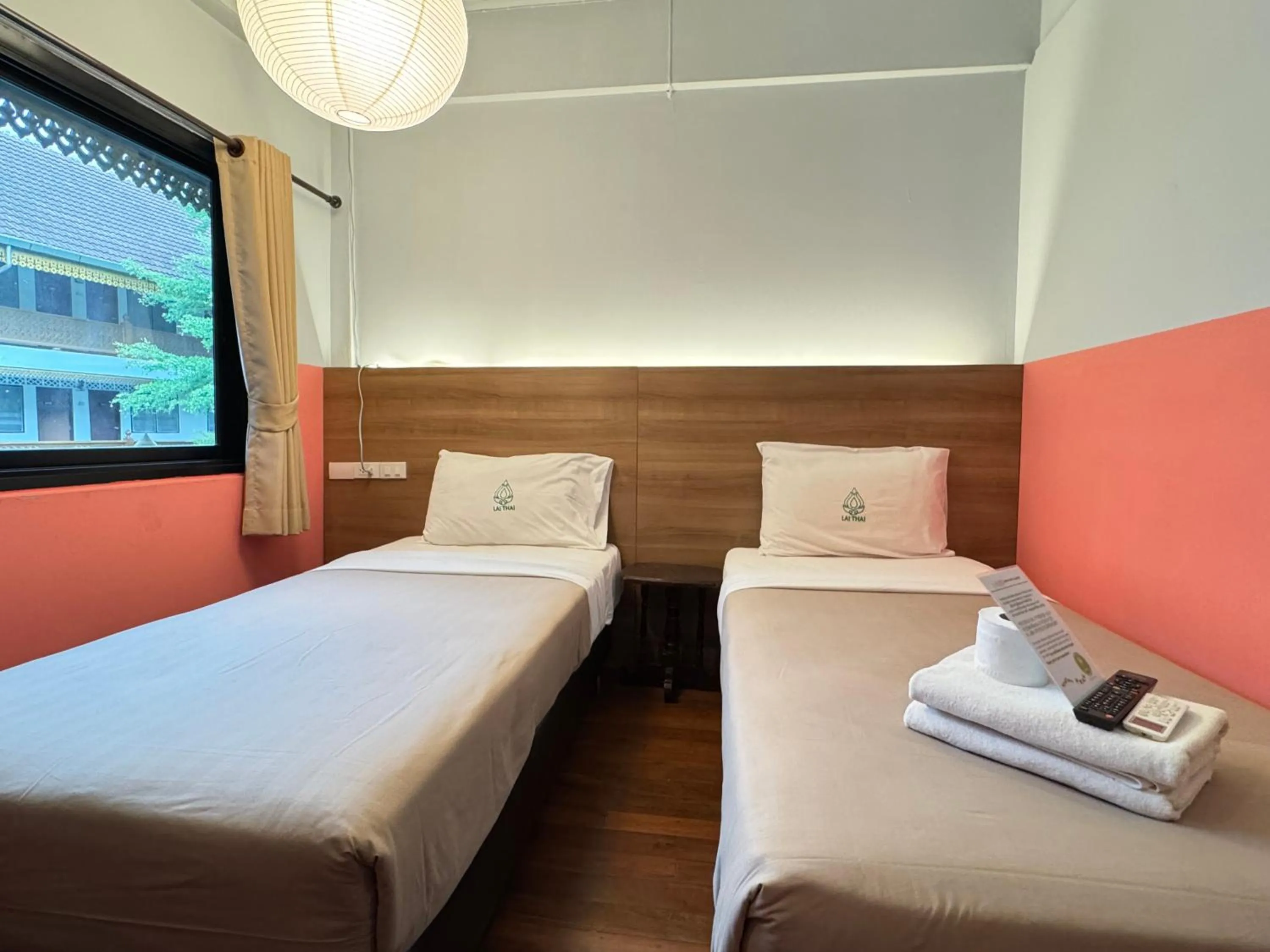 Bed in Lai Thai Guest House