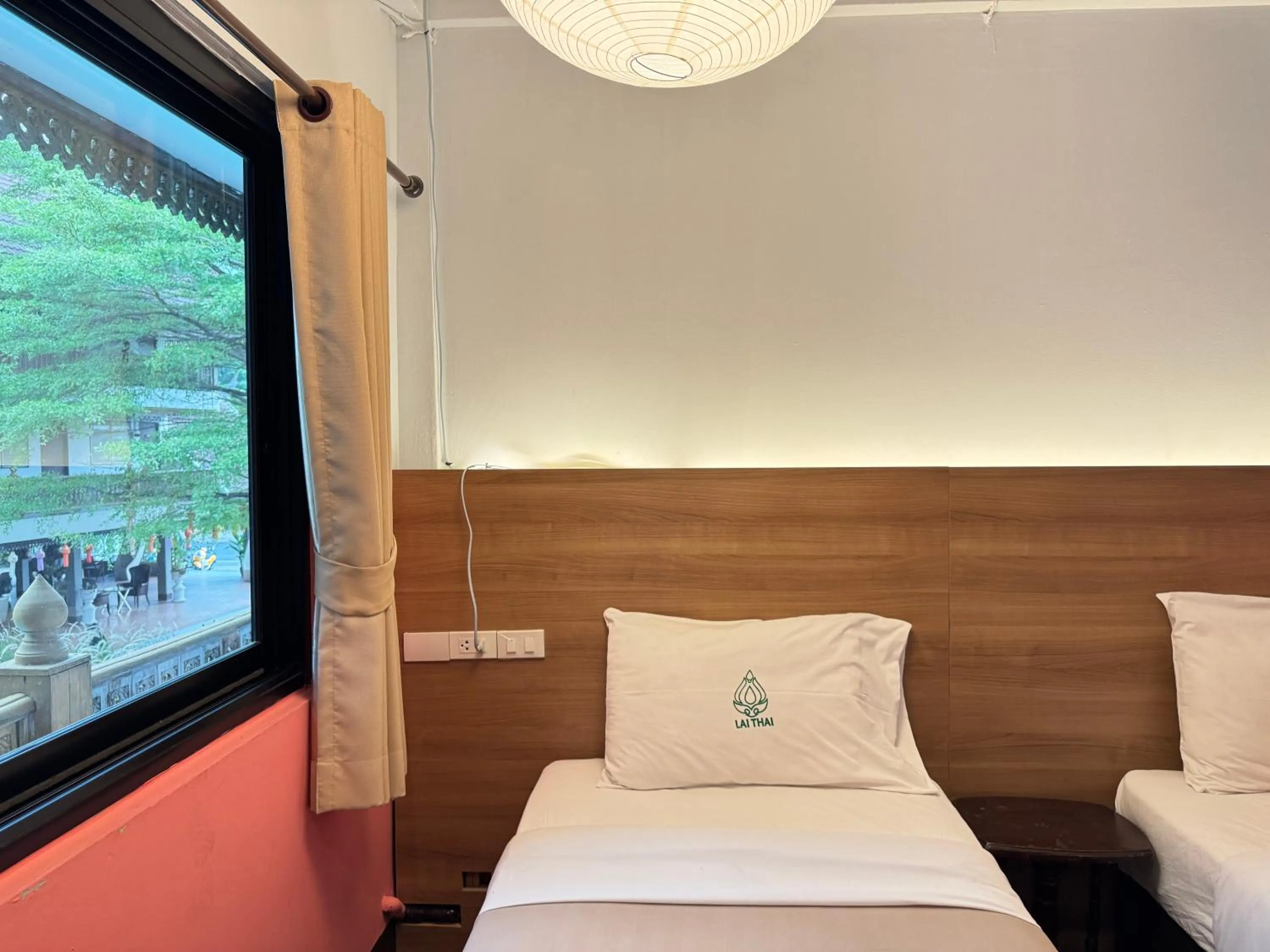 Bed in Lai Thai Guest House