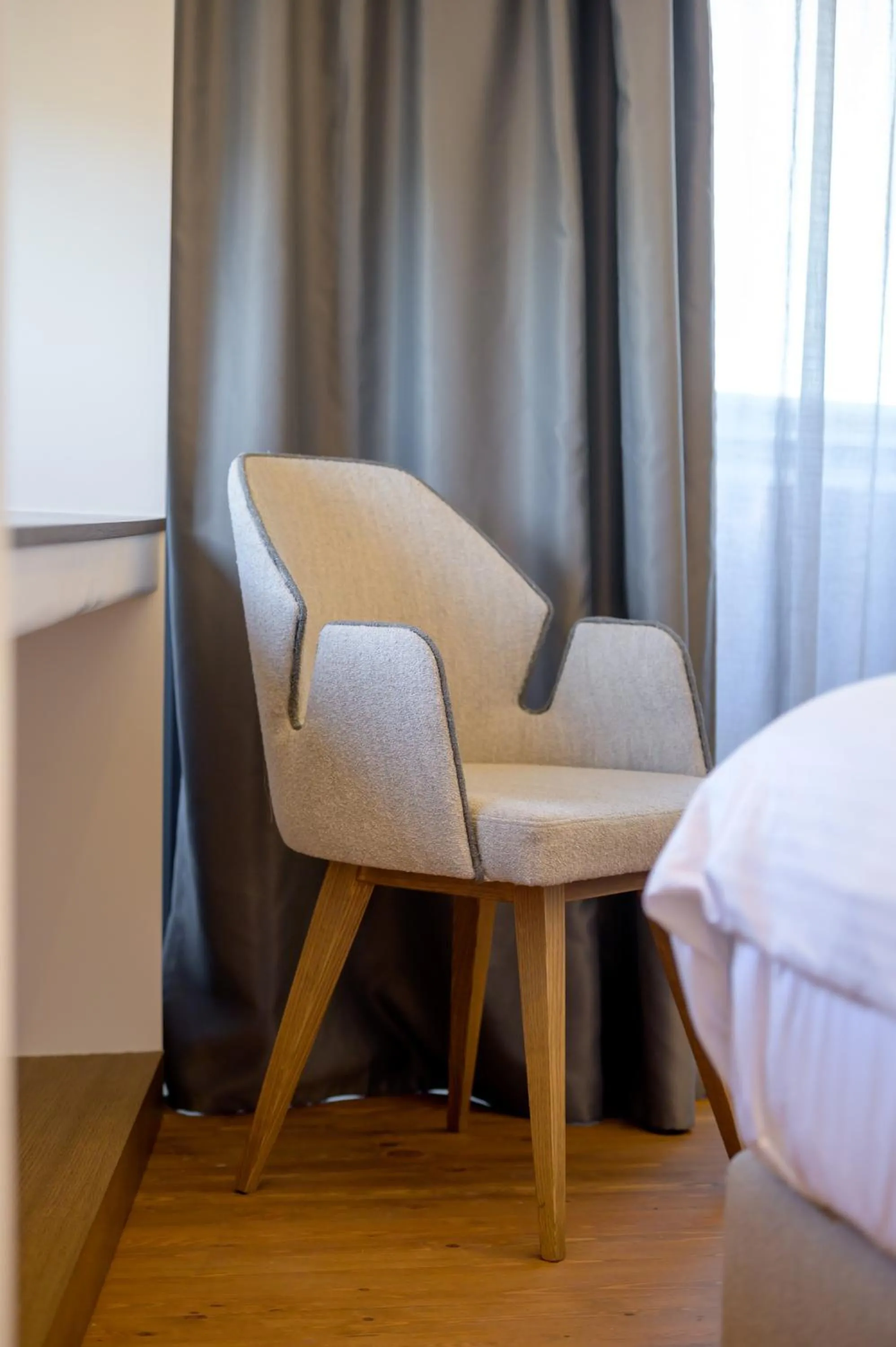 Seating area, Bed in Iraklion Hotel