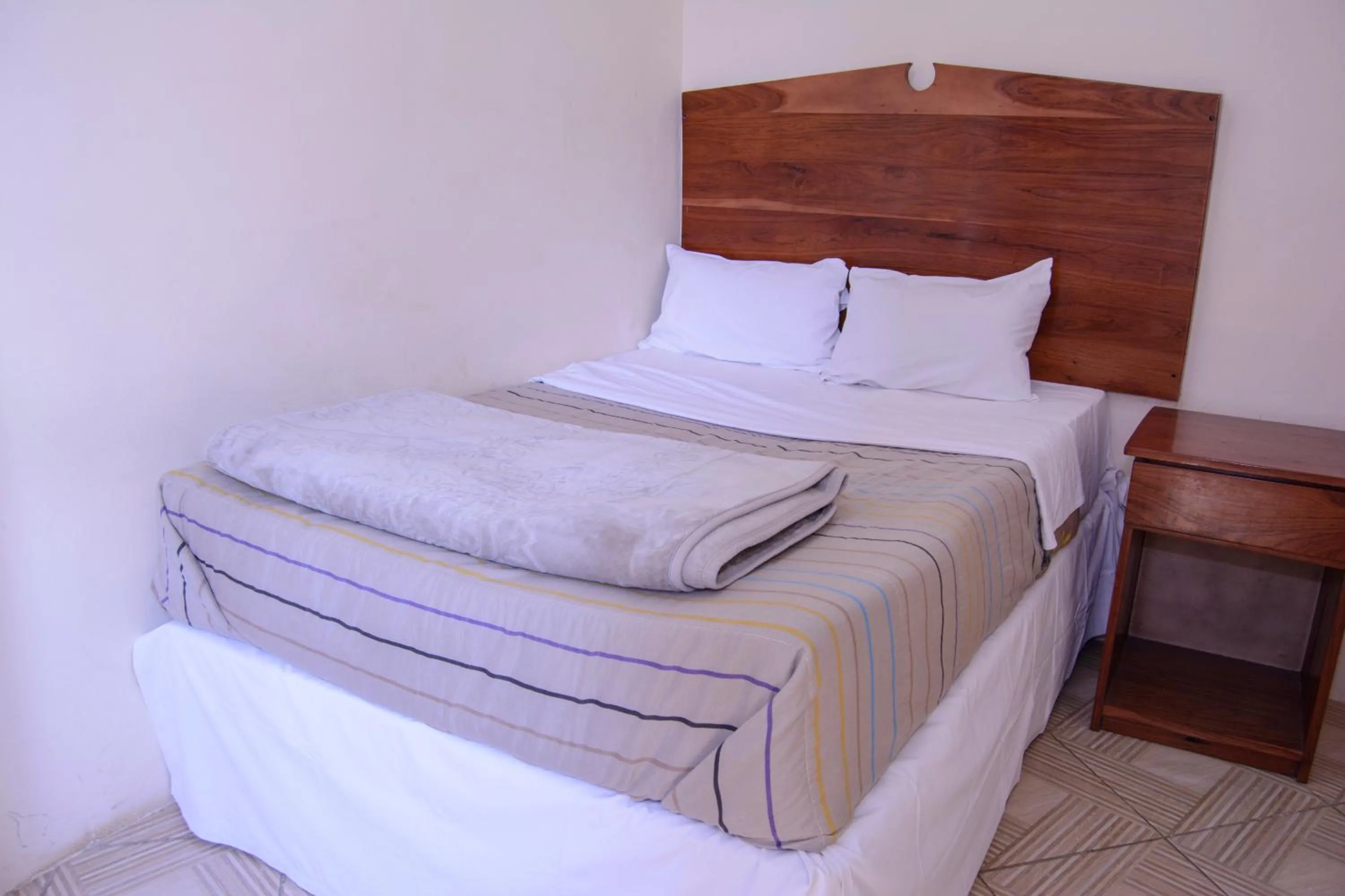 Bed in The Palace Guest House