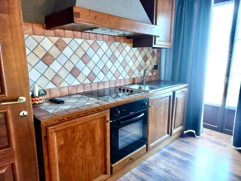 Kitchen or kitchenette in Residence Du Commerce