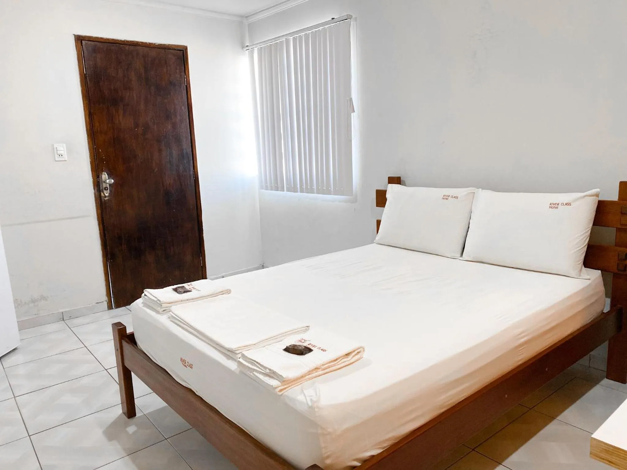 Bed in River Class Hotel