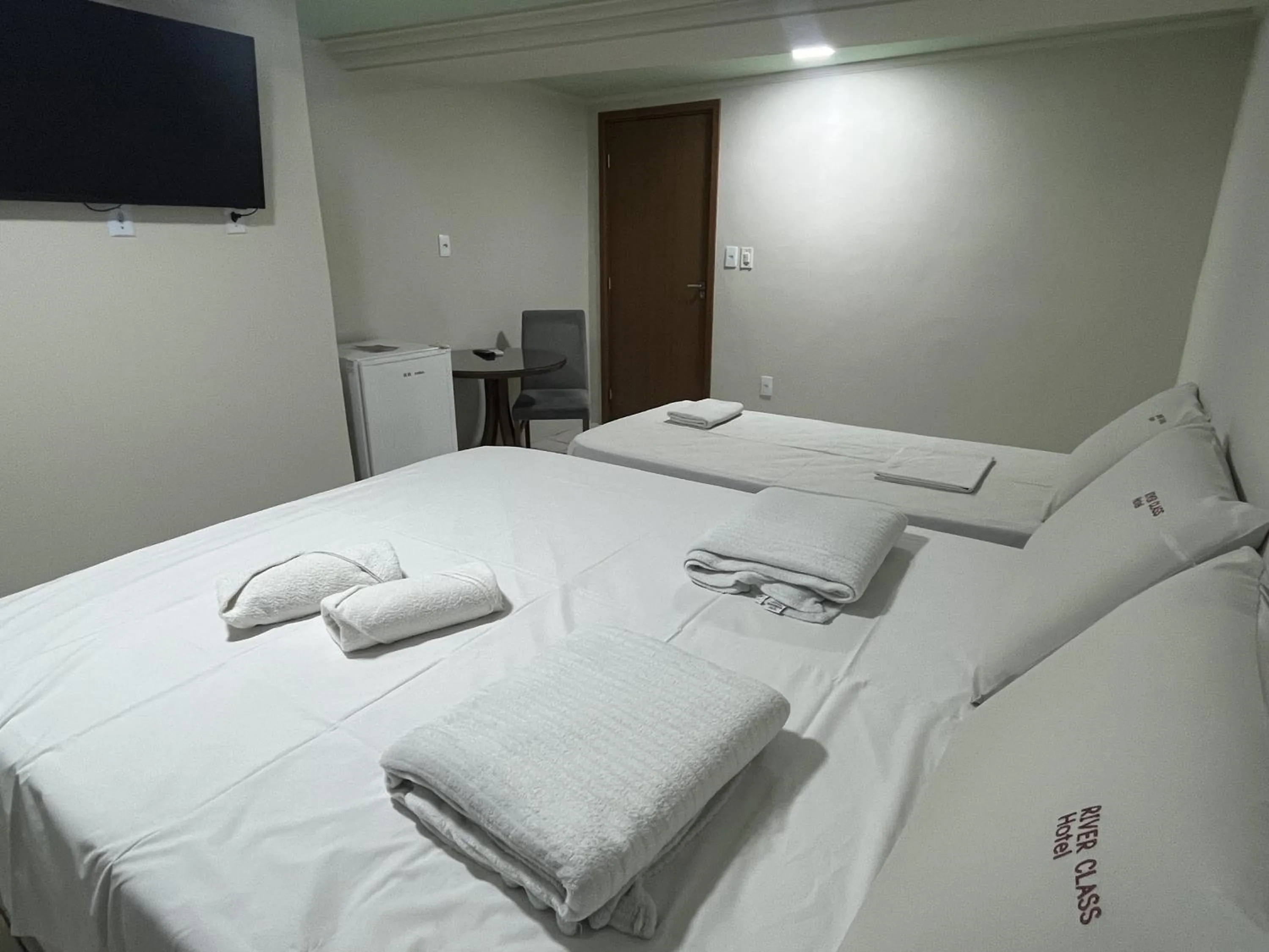 Bed in River Class Hotel